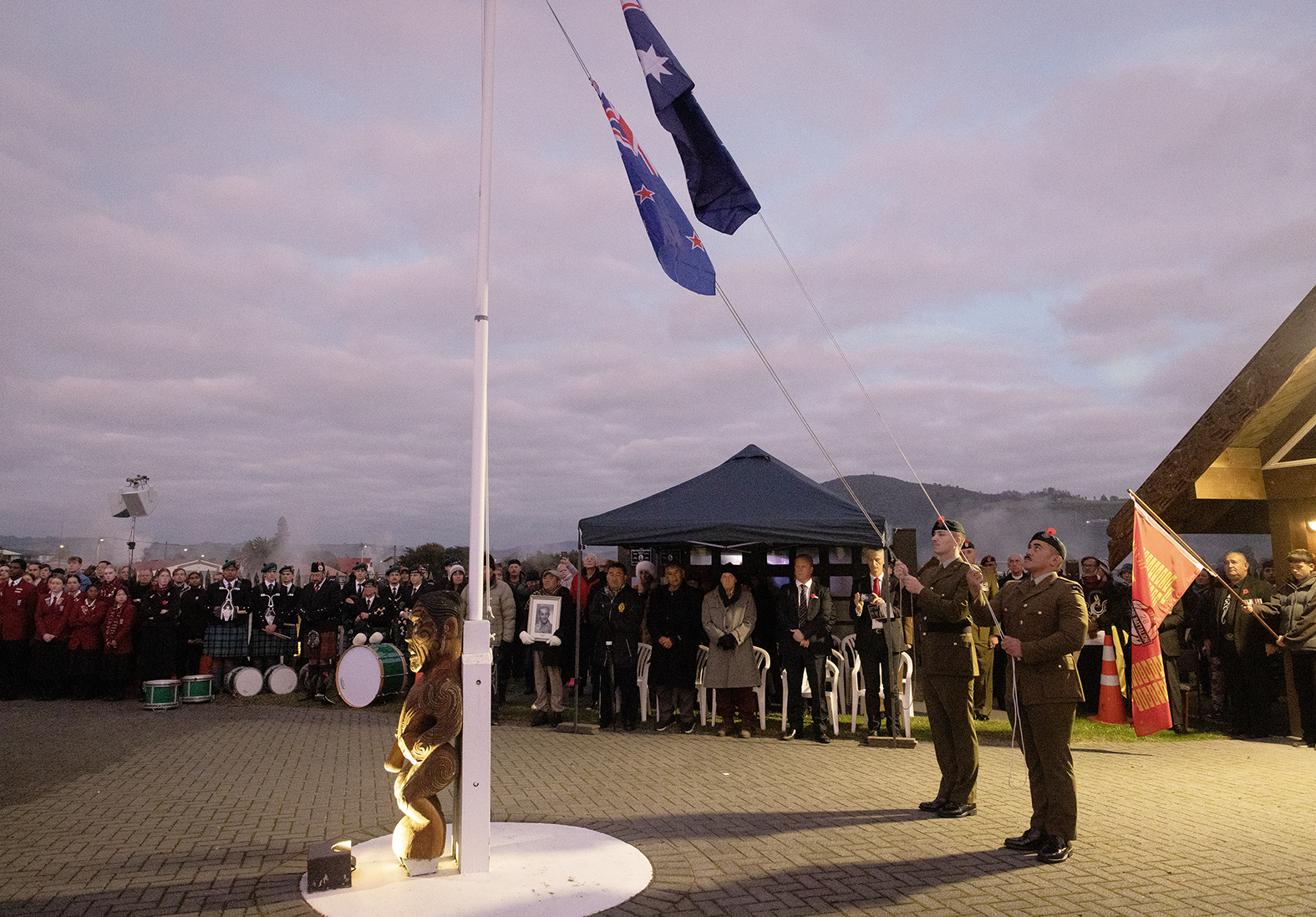 The raising of the New Zealand and Australian flags. Photo / Andrew Warner