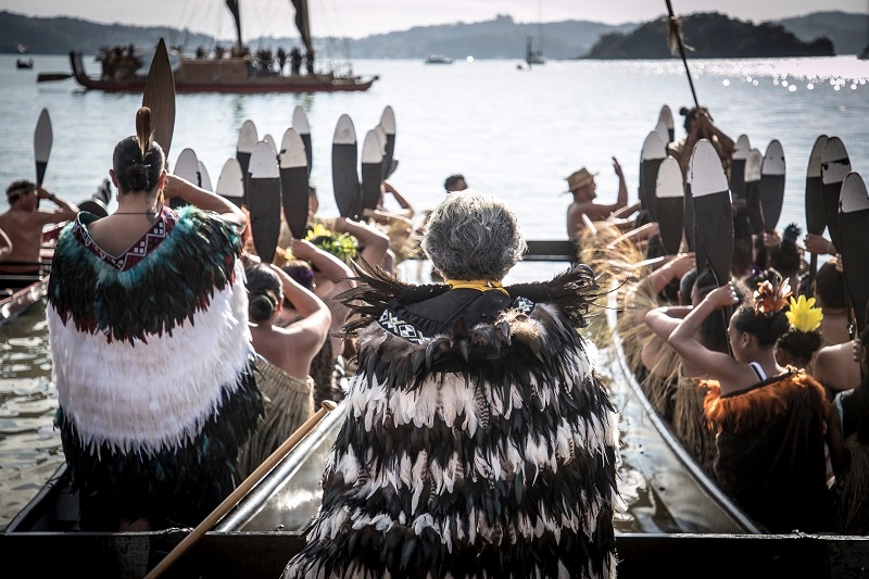 Waka are welcomed to Te Ti Bay, Waitangi. Photo / Michael Craig 