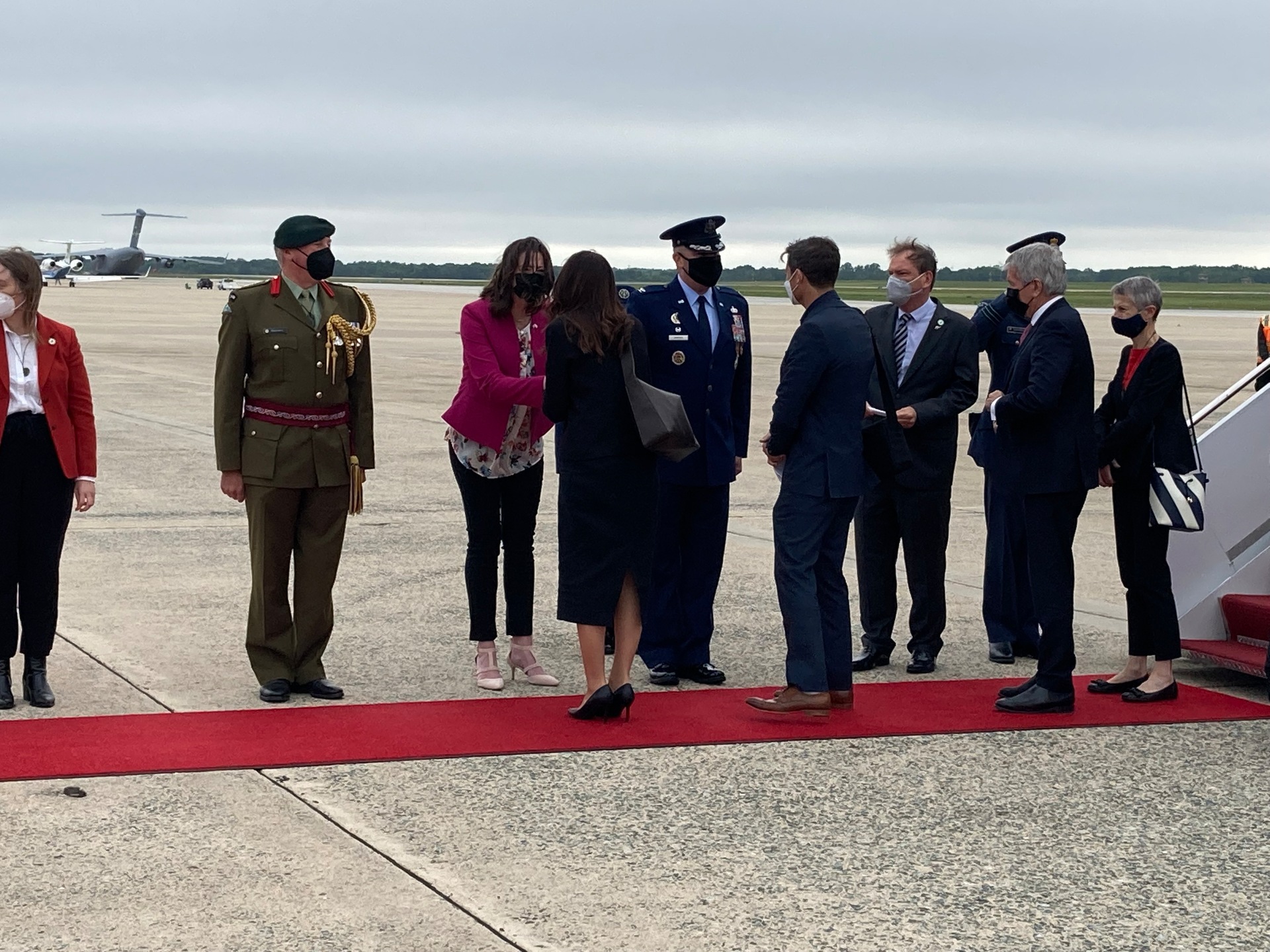 PM Jacinda Ardern, Clarke Gayford, Trade Minister Damien O'Connor and NZ's Ambassador to the US Rosemary Banks are greeted as they disembark the RNZAF Boeing in Washington DC. Photo / Claire Trevett