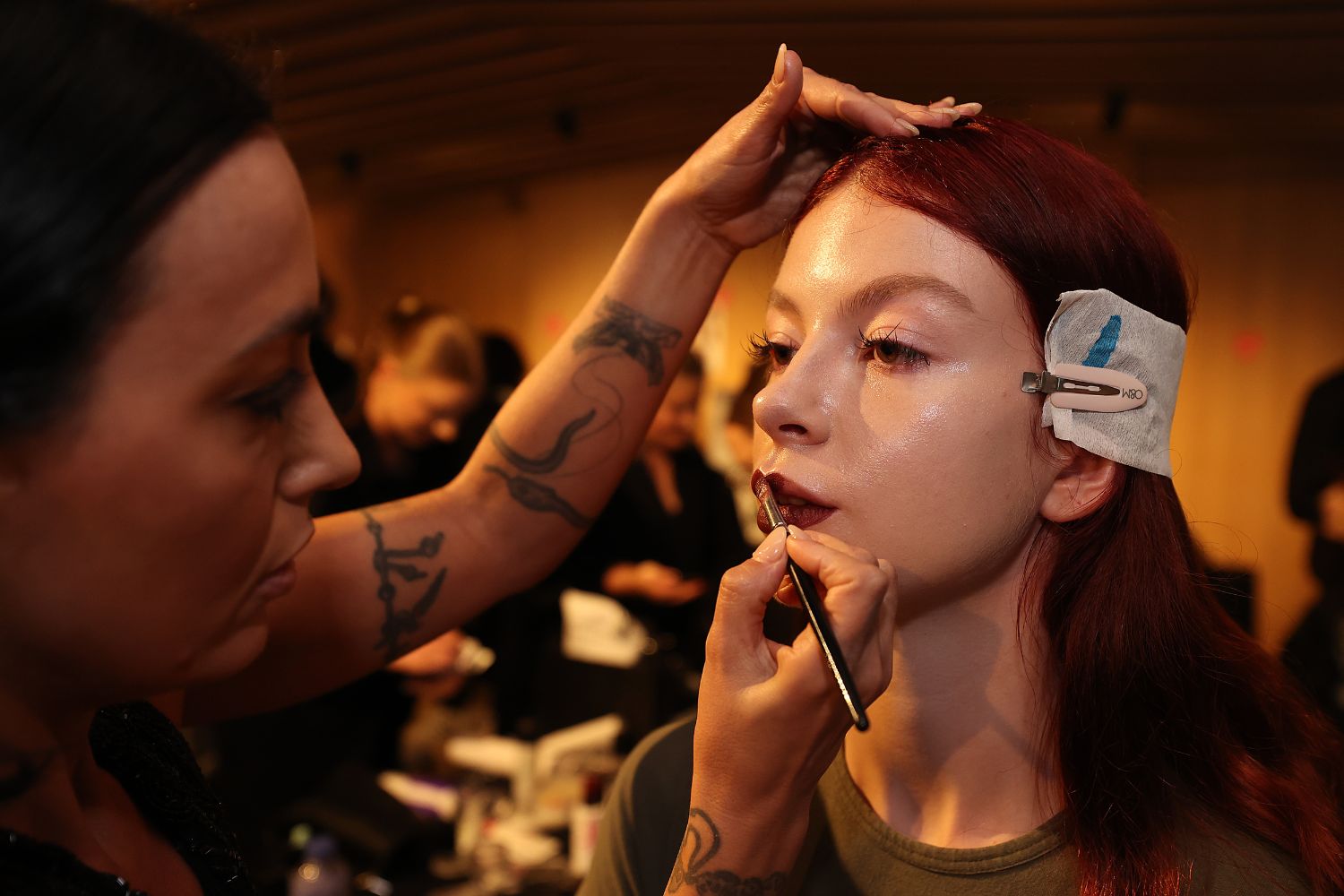 Makeup artist and long-time Zambesi collaborator Kiekie Stanners precisely paints an aubergine lip. Photo / Getty Images