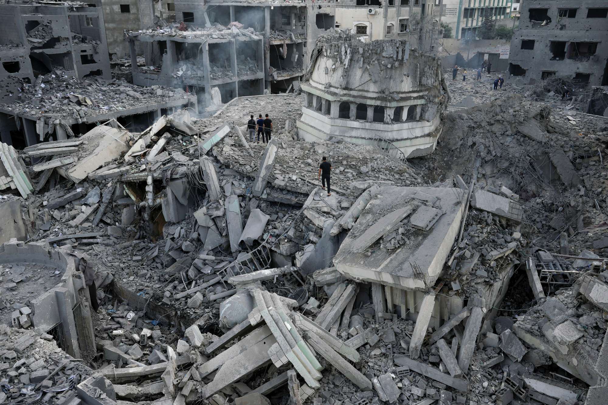 Palestinians inspect the rubble of the Yassin Mosque, which was destroyed after it was hit by an Israeli airstrike at Shati refugee camp in Gaza City. Photo / AP