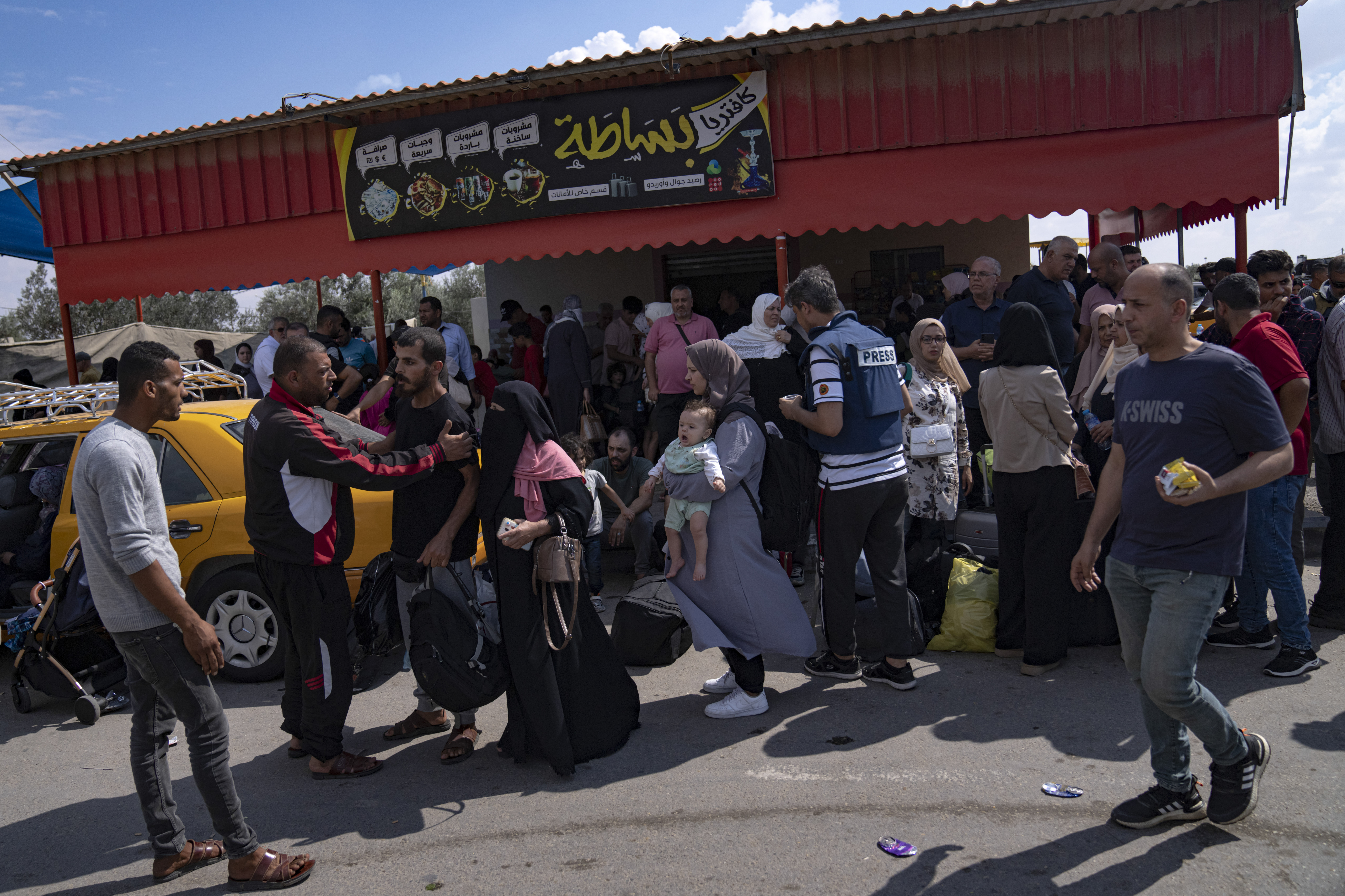Palestinians wait to cross into Egypt at the Rafah border crossing in the Gaza Strip. Photo / AP