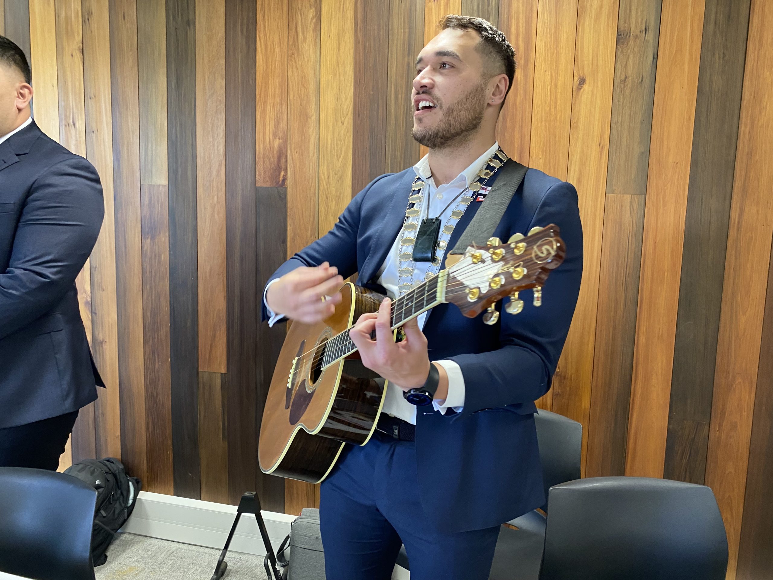 Far North Mayor Moko Tepania plays guitar and sings the Ngāpuhi song Ngā Pūawai after the council meeting that voted to keep Māori wards. Photo / Susan Botting