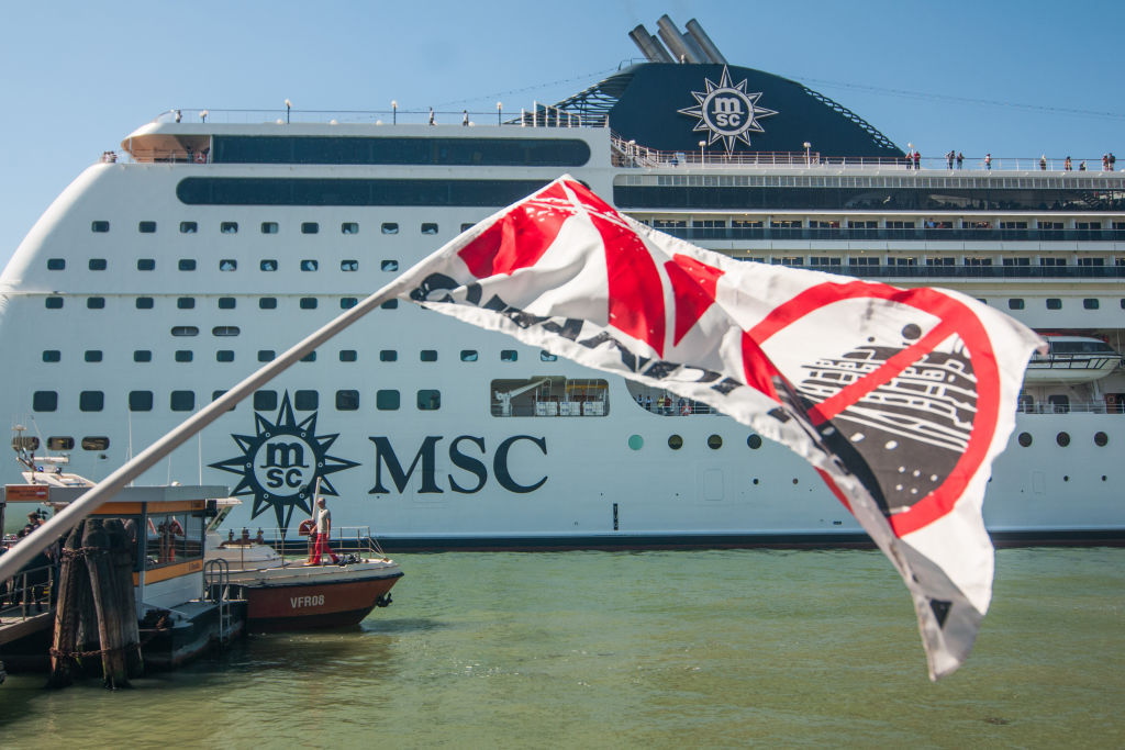 Collision course: Protestors take action after the MSC Opera lost control in the Venice Canal. Photo / Getty Images