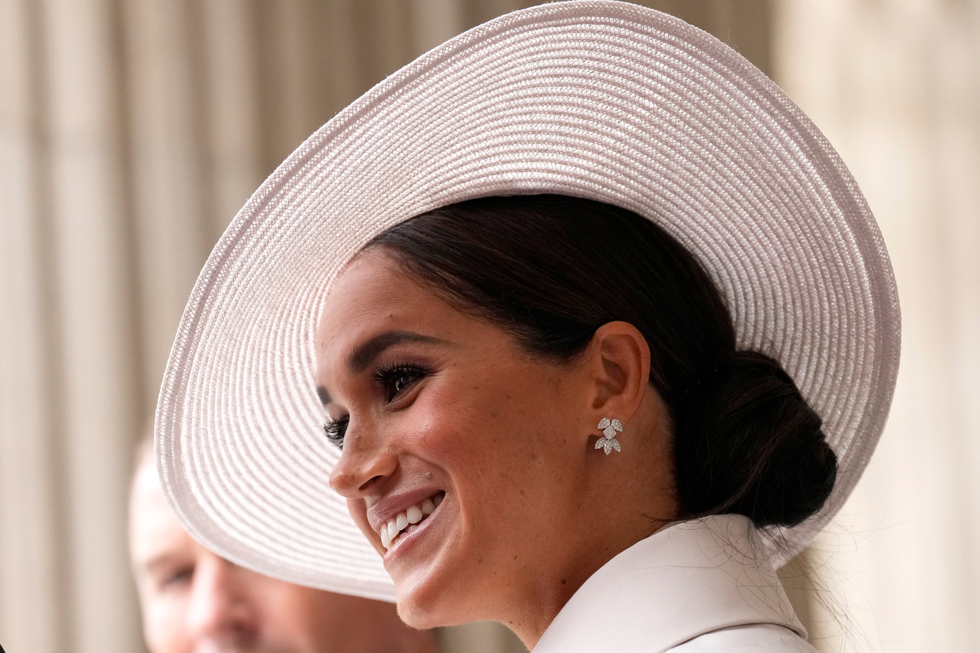 Meghan looked radiant in her first public appearance in the UK since her and Prince Harry decided to quit being working royals. Photo / AP