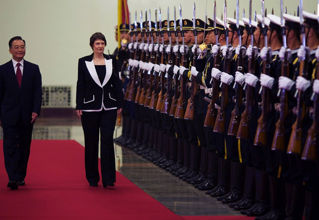 China's former premier Wen Jiabao and Helen Clark review an honour guard at the Great Hall of the People in Beijing in 2020. Photo / Reuters