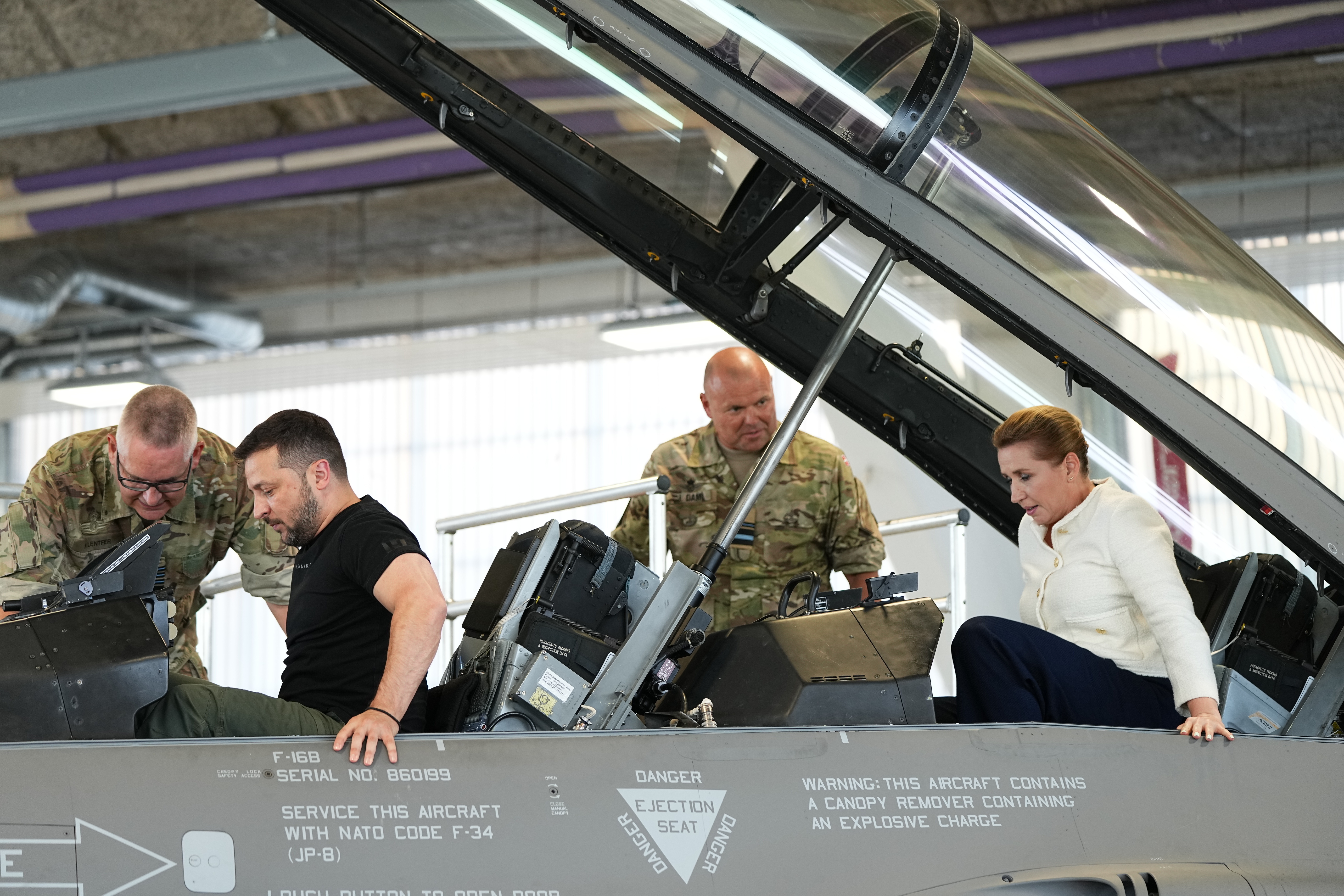 Ukrainian President Volodymyr Zelenskyy (left) and Denmark Prime Minister Mette Frederiksen sit in a F-16 fighter jet at Skrydstrup Airbase in Vojens, Denmark. Photo / AP