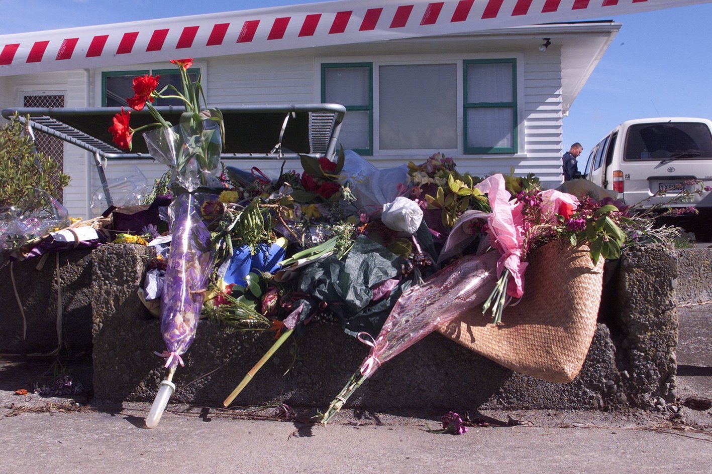 Flowers lined the footpath outside the Lundy home as police and forensic scientists worked at the murder scene in August and September 2000. Photo / Mark Mitchell