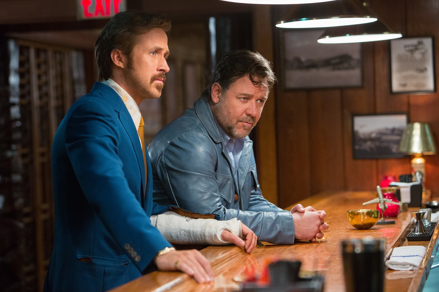 Ryan Gosling and Russell Crowe (right) in film The Nice Guys. A suspected scam fashion site operating on Facebook claimed Crowe was one of its customers. Photo / Supplied