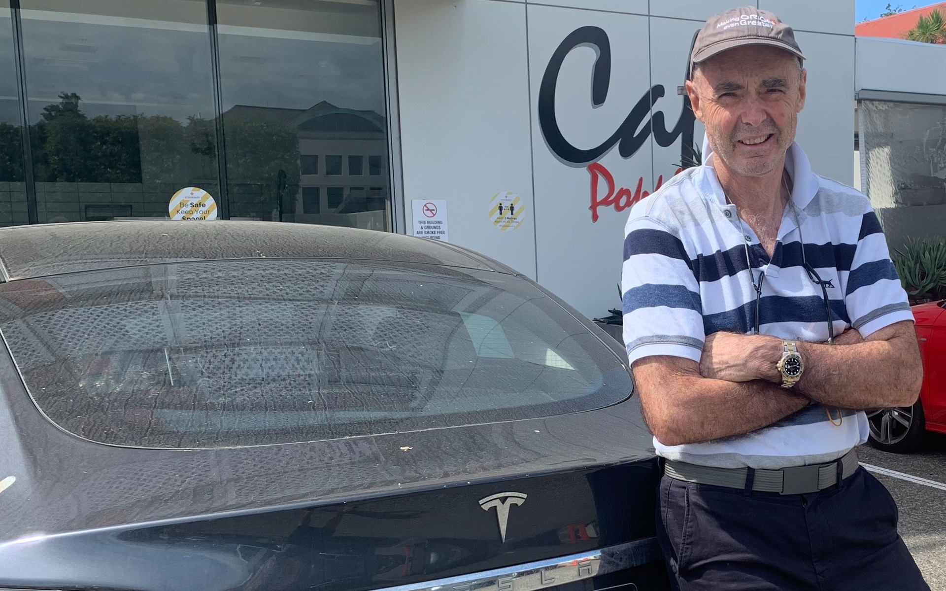 Orion Health chief executive McCrae with his Tesla Model S. Photo / Supplied
