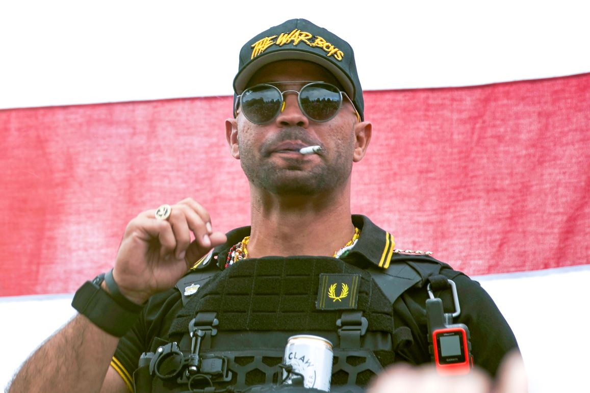 Proud Boys leader Henry 'Enrique' Tarrio wears a hat that says The War Boys during a rally in Portland. Photo / AP