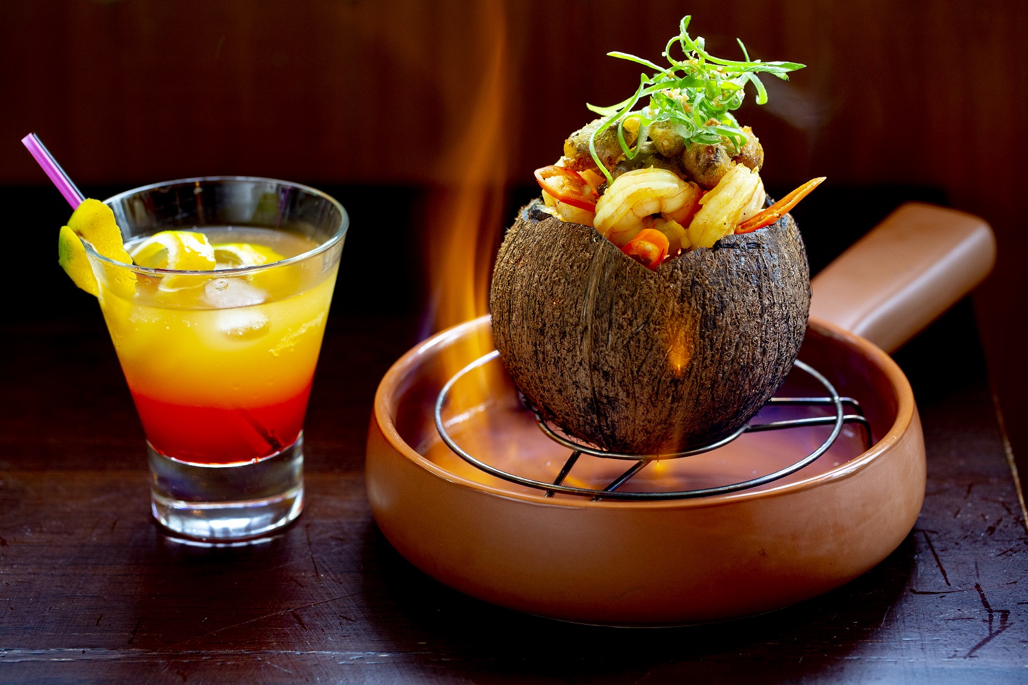  The flaming coconut prawn curry. Photo / Babiche Martens