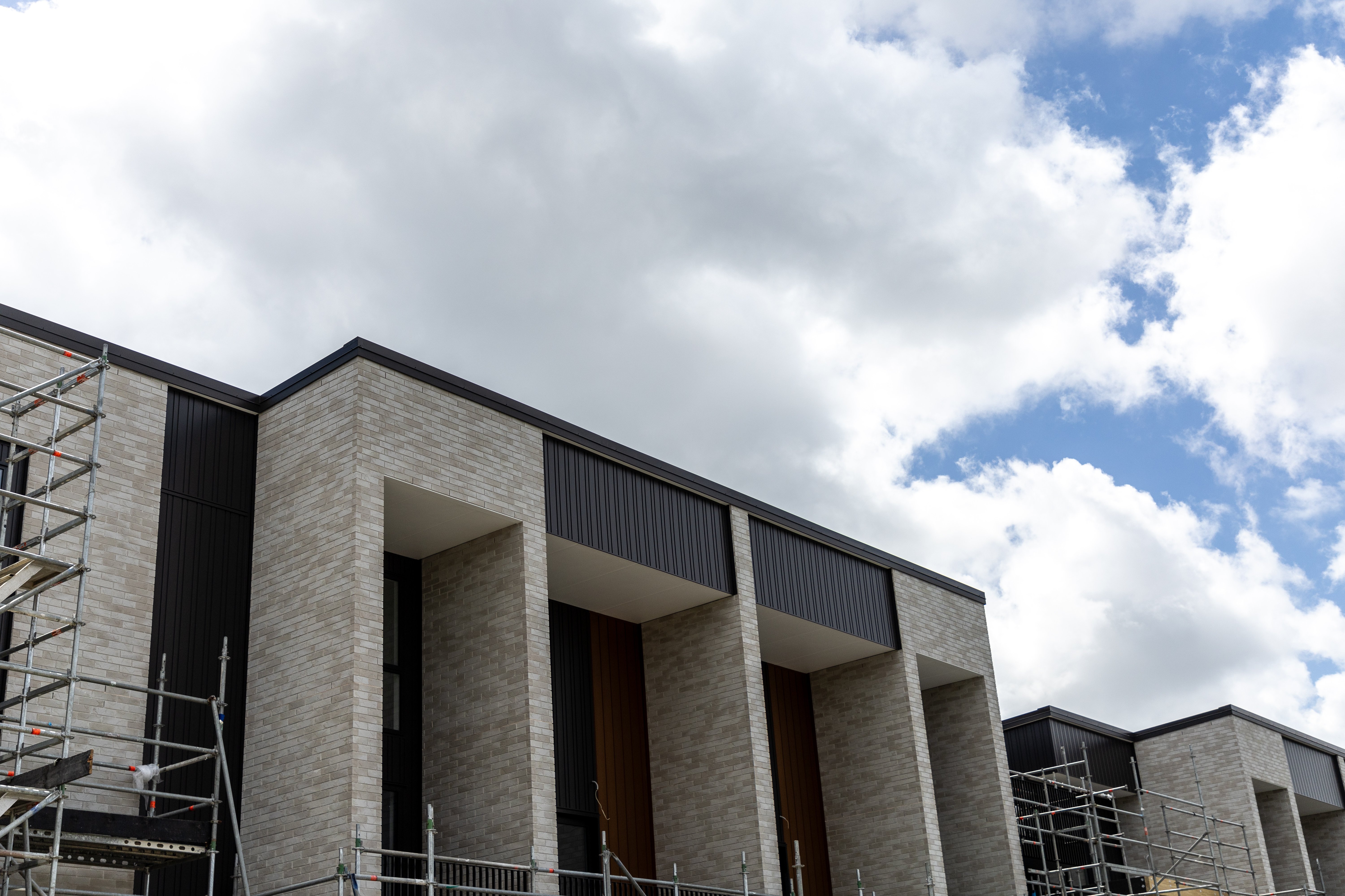 Thirty terrarce homes have been built in the centre of the ex-Winstone quarry at Three Kings. Fletcher Living is developing them. Photo / Michael Craig