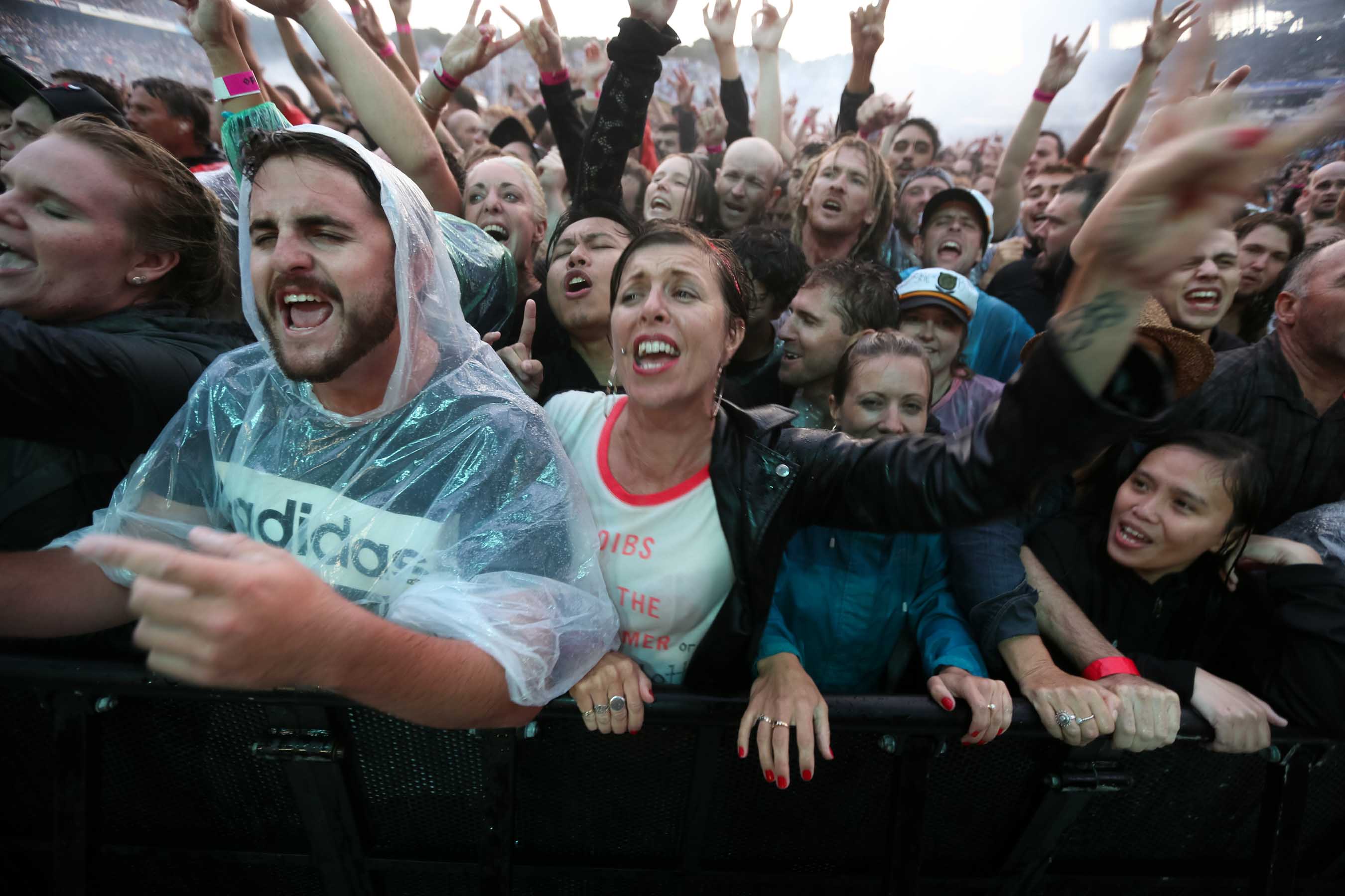 Rain soaked fans watch the Foo Fighters. Photo / Chris Loufte