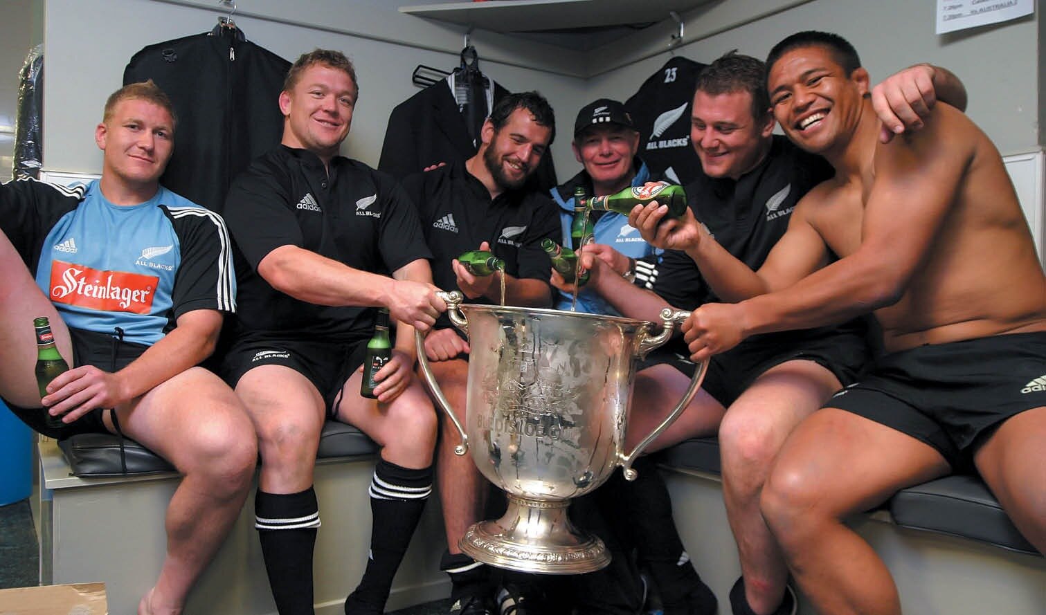 Mike Cron - third from right - and All Blacks players toast defending the Bledisloe Cup in 2005. Photo / Supplied