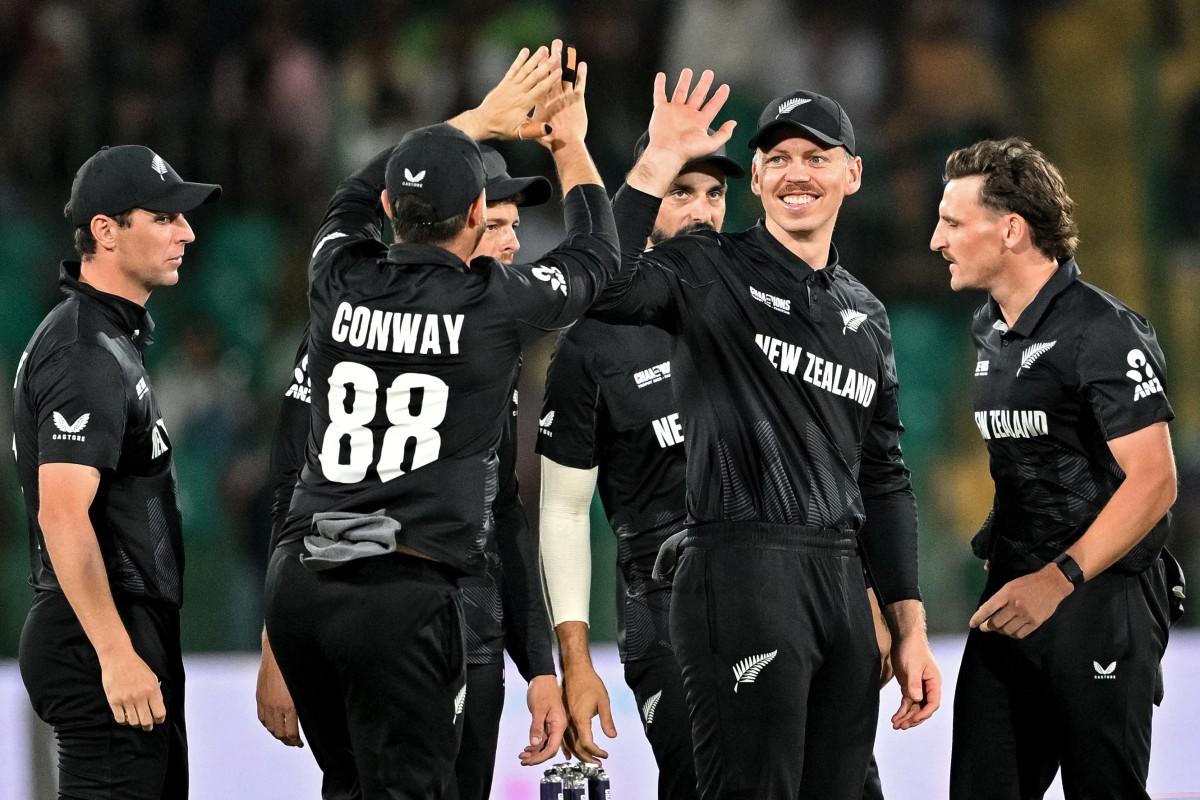 The Black Caps celebrate taking a wicket against Pakistan. Photo / AFP