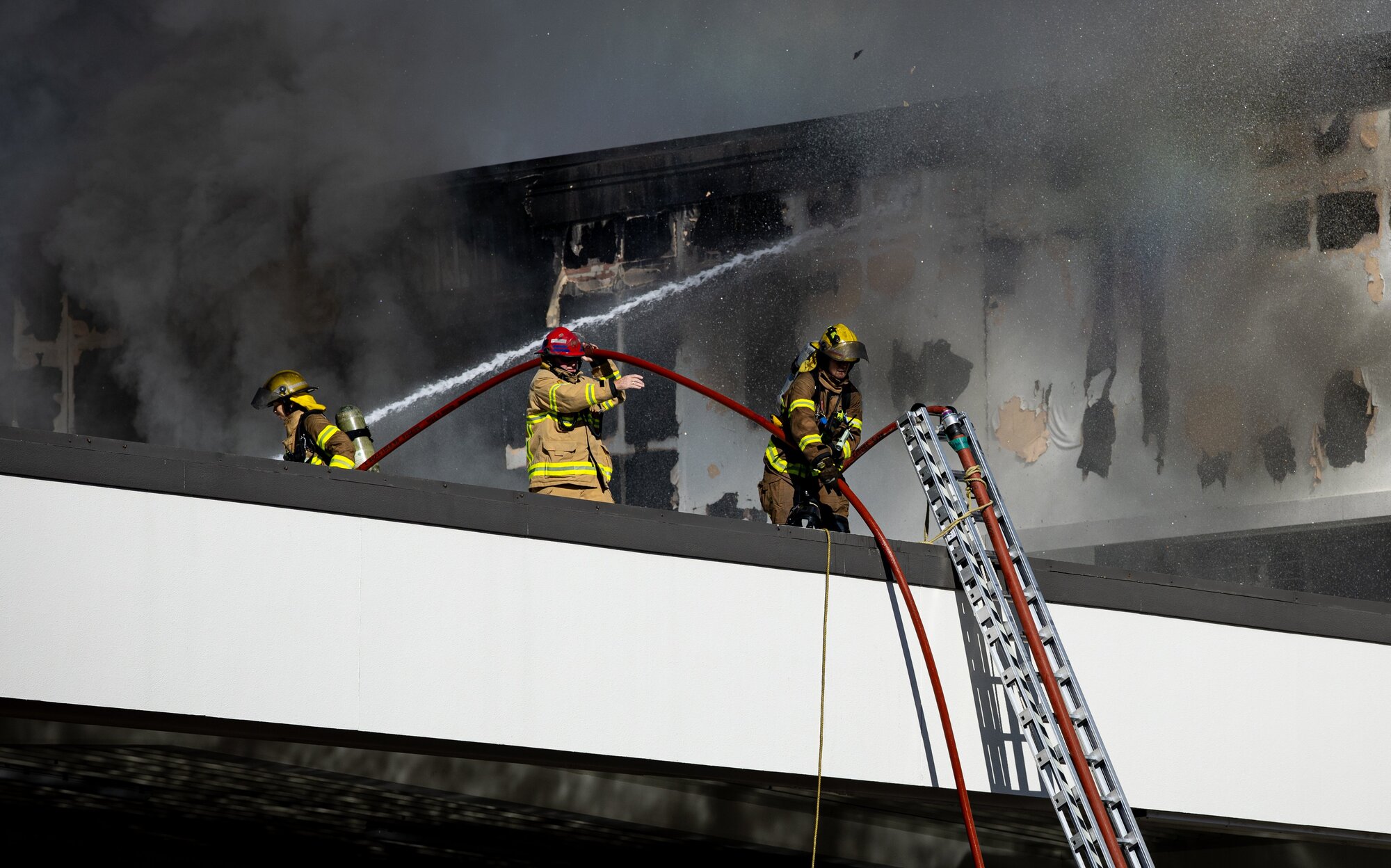 Thick black smoke engulfing New World Victoria Park supermarket during yesterday's fire. Photo / Dean Purcell