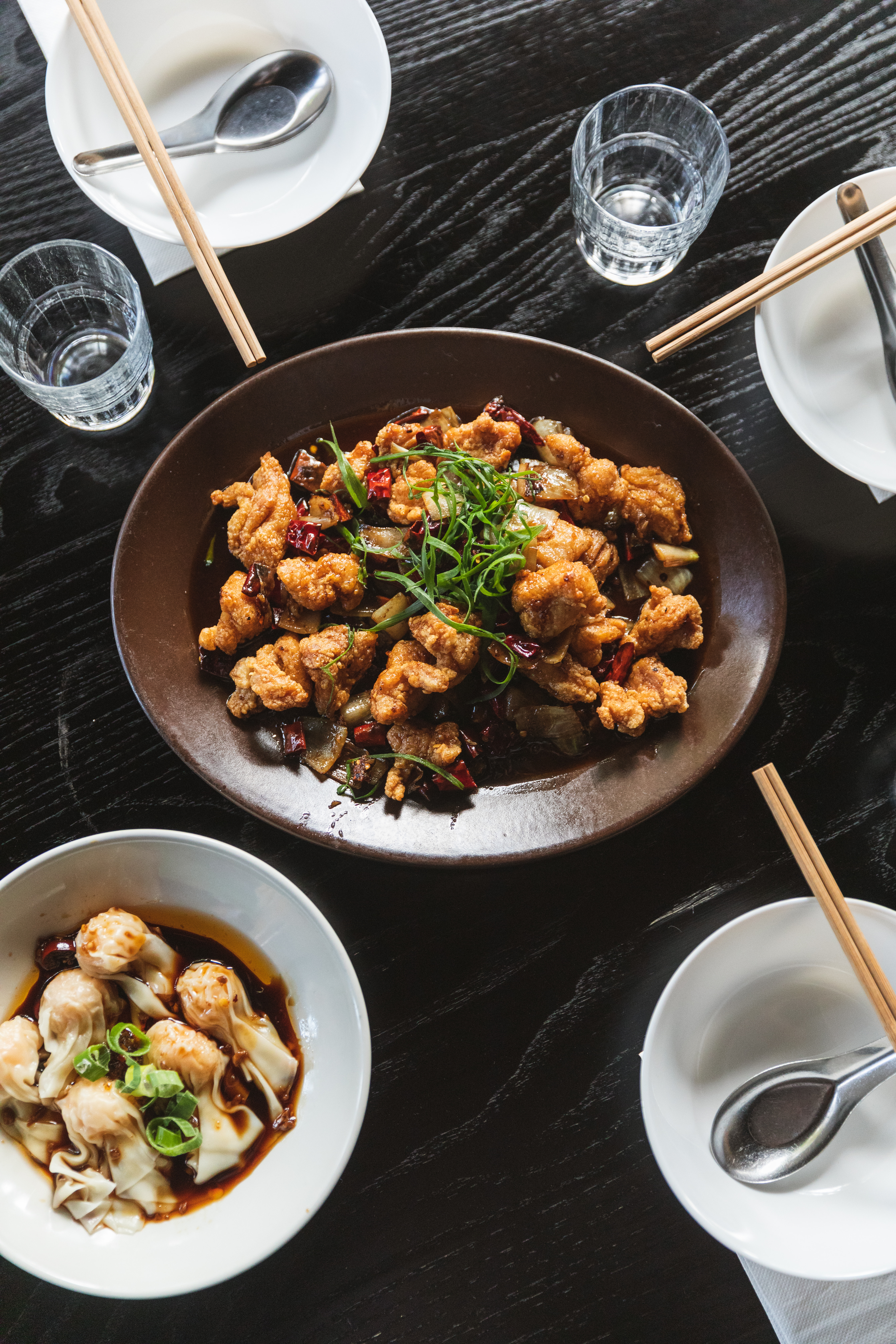 Wok-tossed chicken and chilli, and wontons in soy and chilli oil from Snack Man. Photo / Callie Marshall
