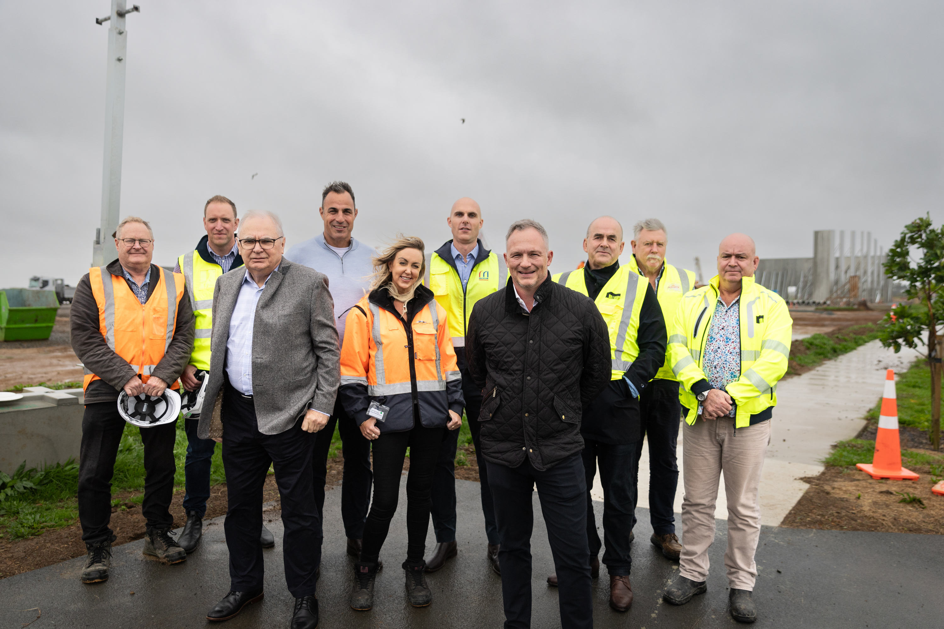James Kirkpatrick jnr (centre, black jacket) with (from left) Tony Day (Day Consulting), Sam Gordon (Macrennie Construction), Russell Bartlett, KC, Hamish Firth (Mt Hobson Group), Aoife Mac Sharry (JKGL), Michael White (Macrennie Construction), Simon Williams (Williams Architects), Mark Hellyer (JKGL) and Quenten Pilgrem (Williams Architects). Photo / Michael Craig