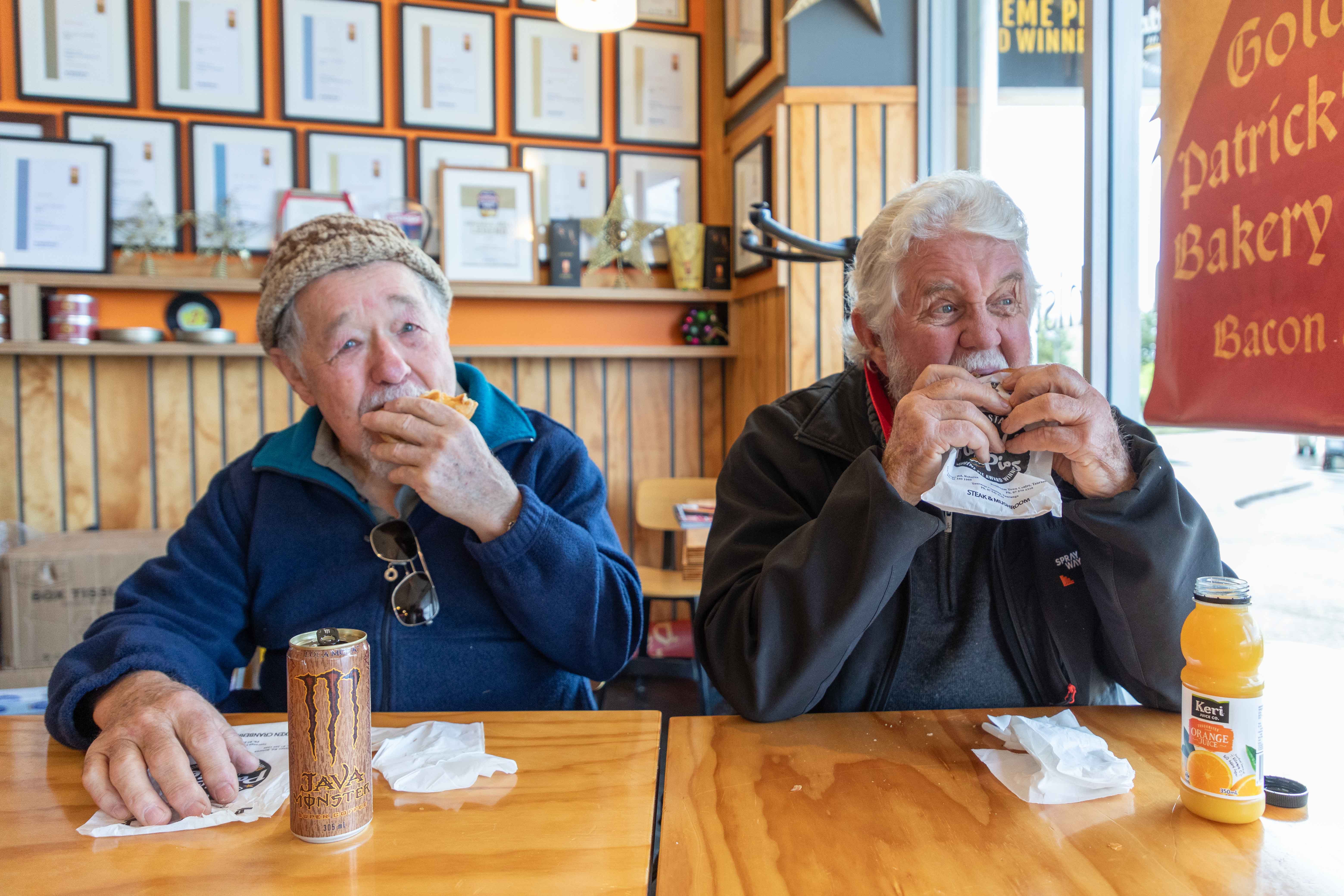 Don Shatford (left) and Doug Brown enjoying a bite to eat at Patrick's Pies in Bethlehem after Patrick Lam won Bakels NZ supreme award for one of his pies. Photo / Alex Cairns