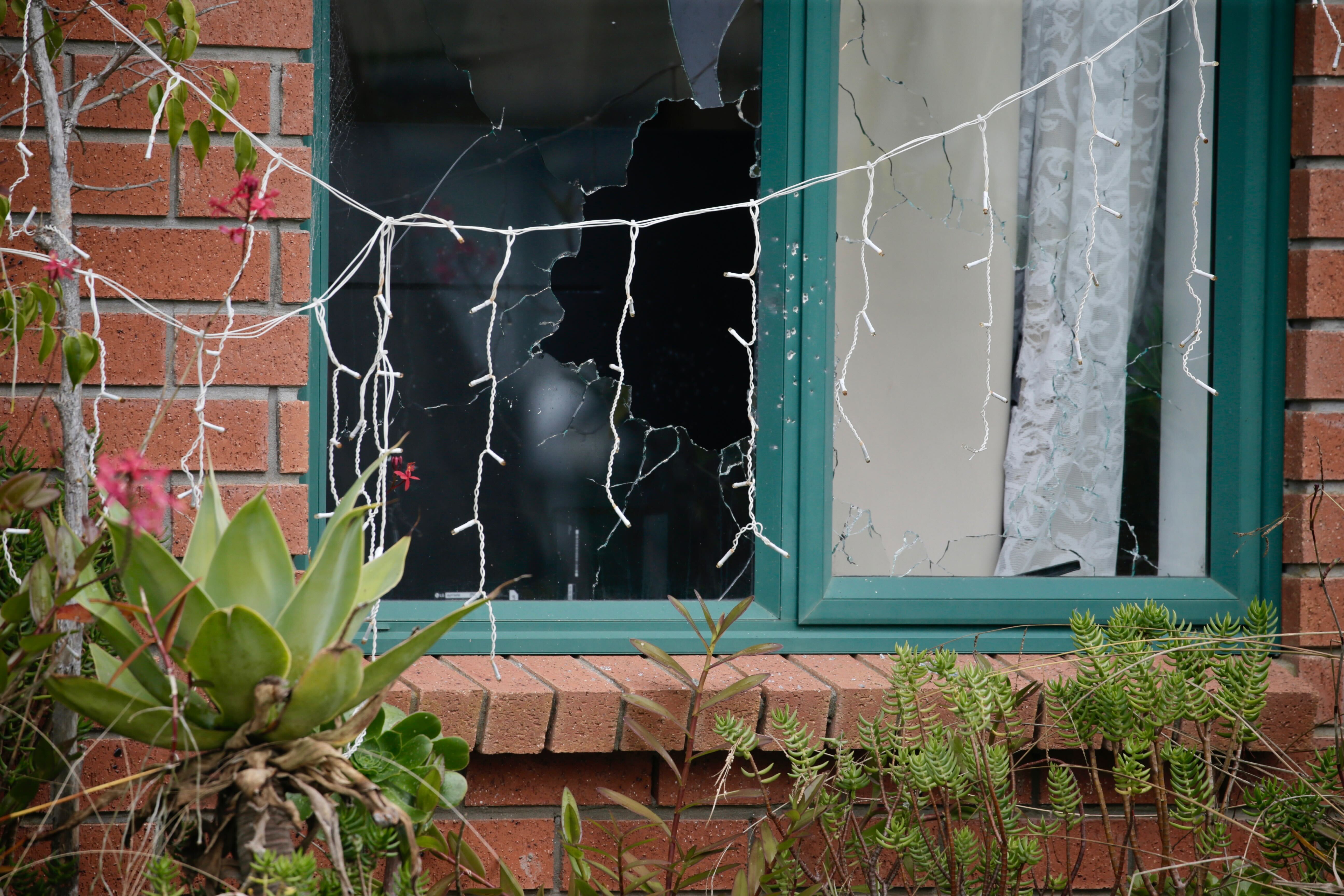 Bullets shattered the windows of the state house during the attack on Saturday Night. Photo / Alex Burton