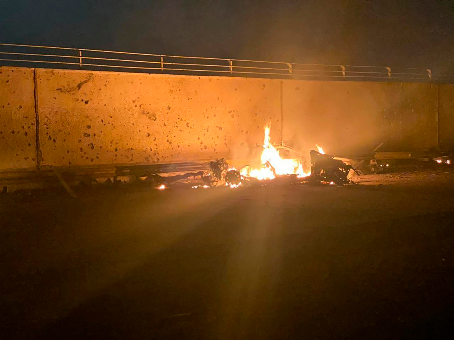 This photo released by the Iraqi Prime Minister Press Office shows a burning vehicle at the Baghdad International Airport following a US airstrike. Photo / via AP