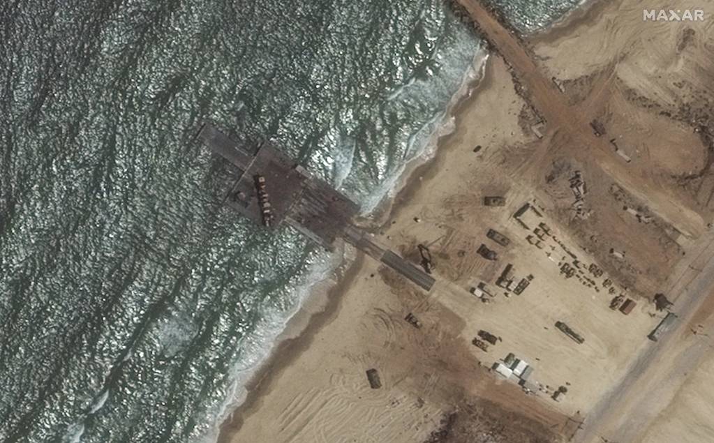 This satellite image shows the remaining section of the temporary pier on Wednesday. Photo / AP