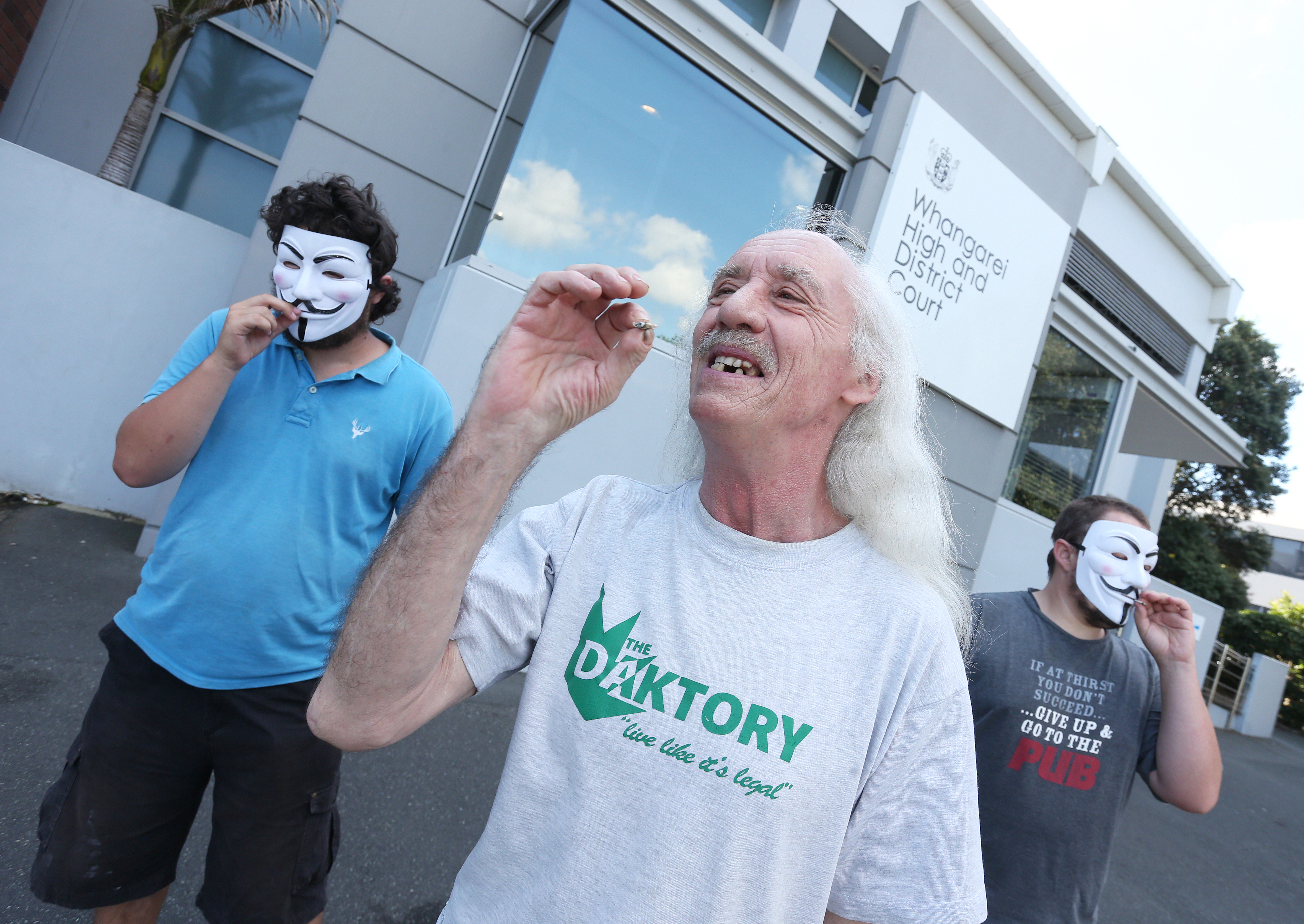 Pro-cannabis activist Brian Thomas Borland of the Daktory Social Club openly smoking cannabis outside the Whangarei law courts. Photo / Michael Cunningham