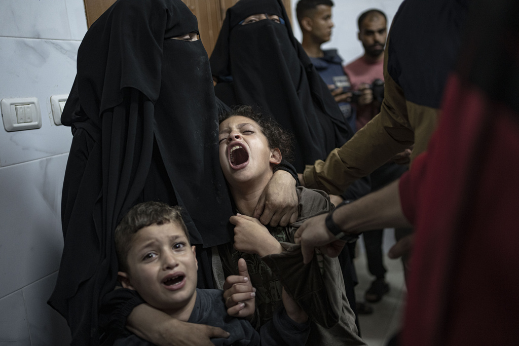 Palestinians mourn their relatives killed in the Israeli bombardment of the Gaza Strip in the hospital in Khan Younis on November 11. Photo / AP