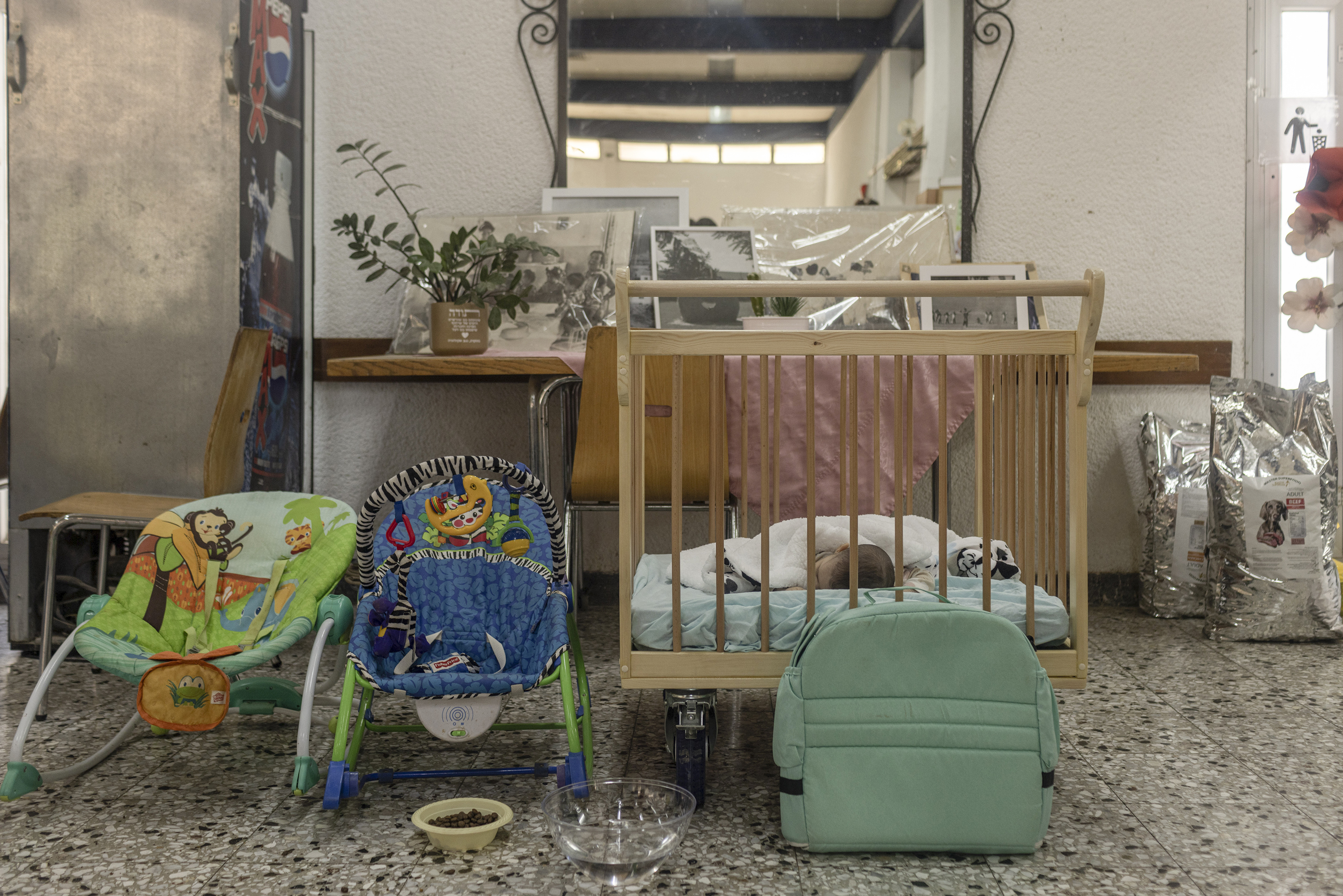 An infant sleeping in a dining room in Kibbutz Mishmar HaNegev on Sunday after being rescued with a family that was hiding in a house in Kibbutz Kfar. Photo / Avishag Shaar-Yashuv, The New York Times