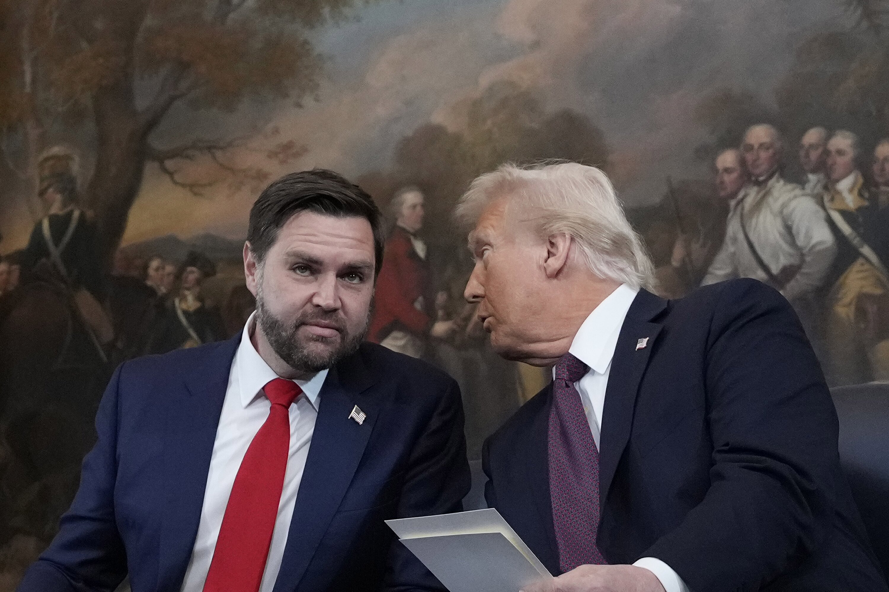 US Vice President-elect JD Vance and US President-elect Donald Trump are seen on stage before taking their oaths of office during the Inauguration in the US Capitol Rotunda. Photo / Getty Images