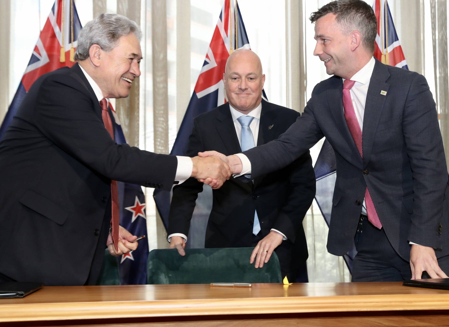 Act leader David Seymour and New Zealand First leader Winston Peters shake hands as they sign their new Government deal. November 24, 2023. Photo / Mark Mitchell