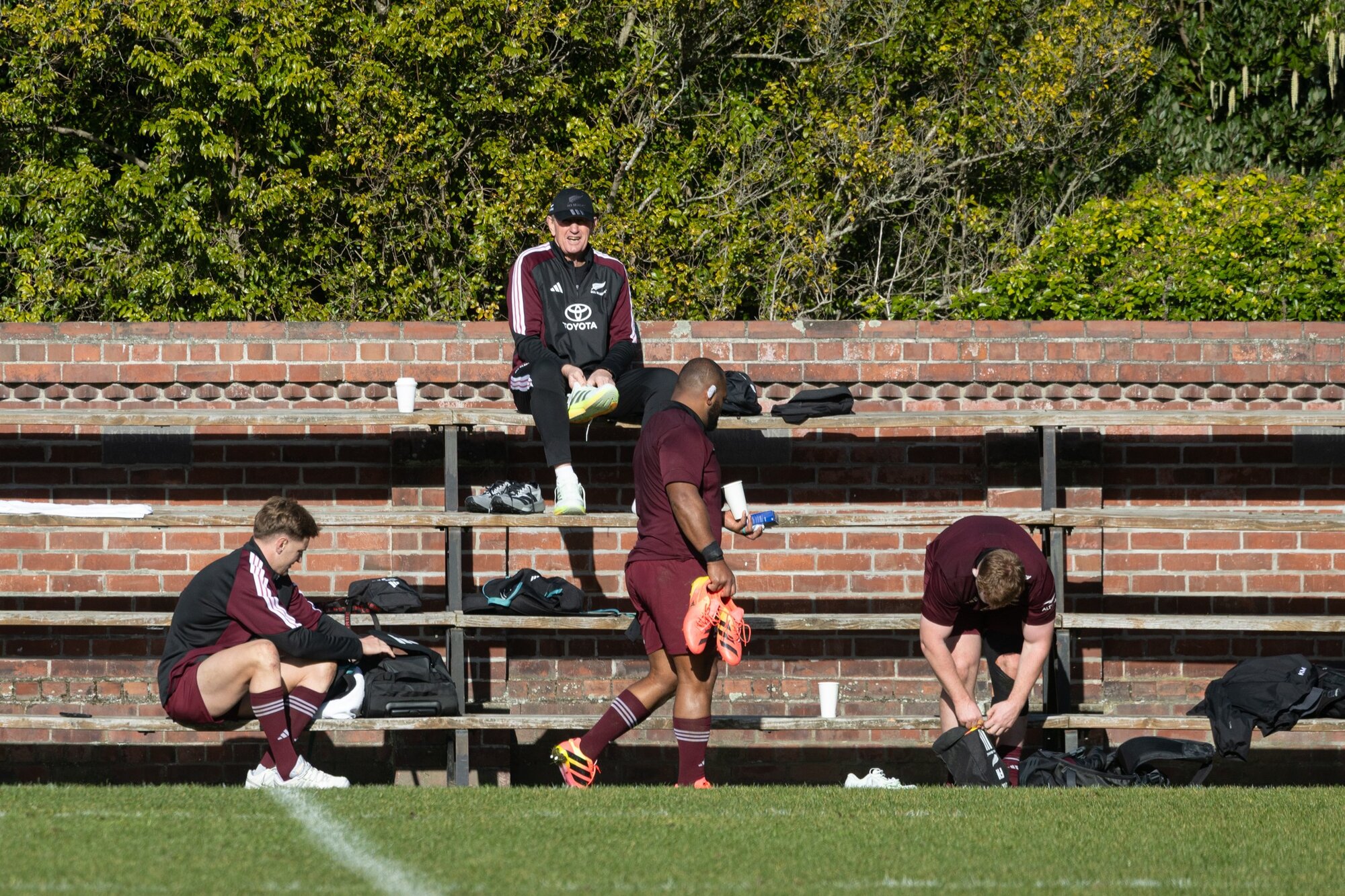 All Blacks assistant coach Neil Barnes with Jordie Barrett, George Bower and Fletcher Newell at Christ's College ahead of the first test of the year against France. Photo / Anna Heath. 