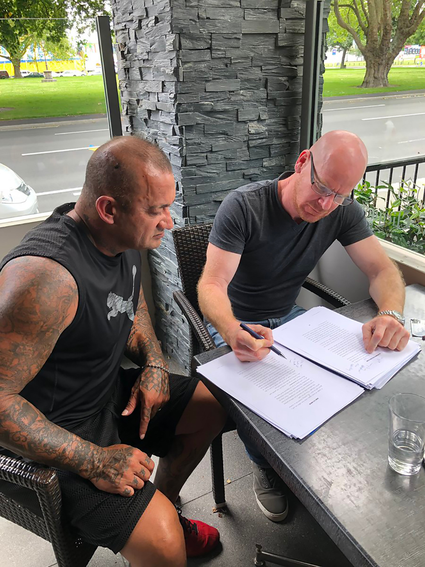 Former Rebels gang member Shane Martin, left, with gang researcher Dr Jarrod Gilbert working on Martin's book. Photo / Supplied