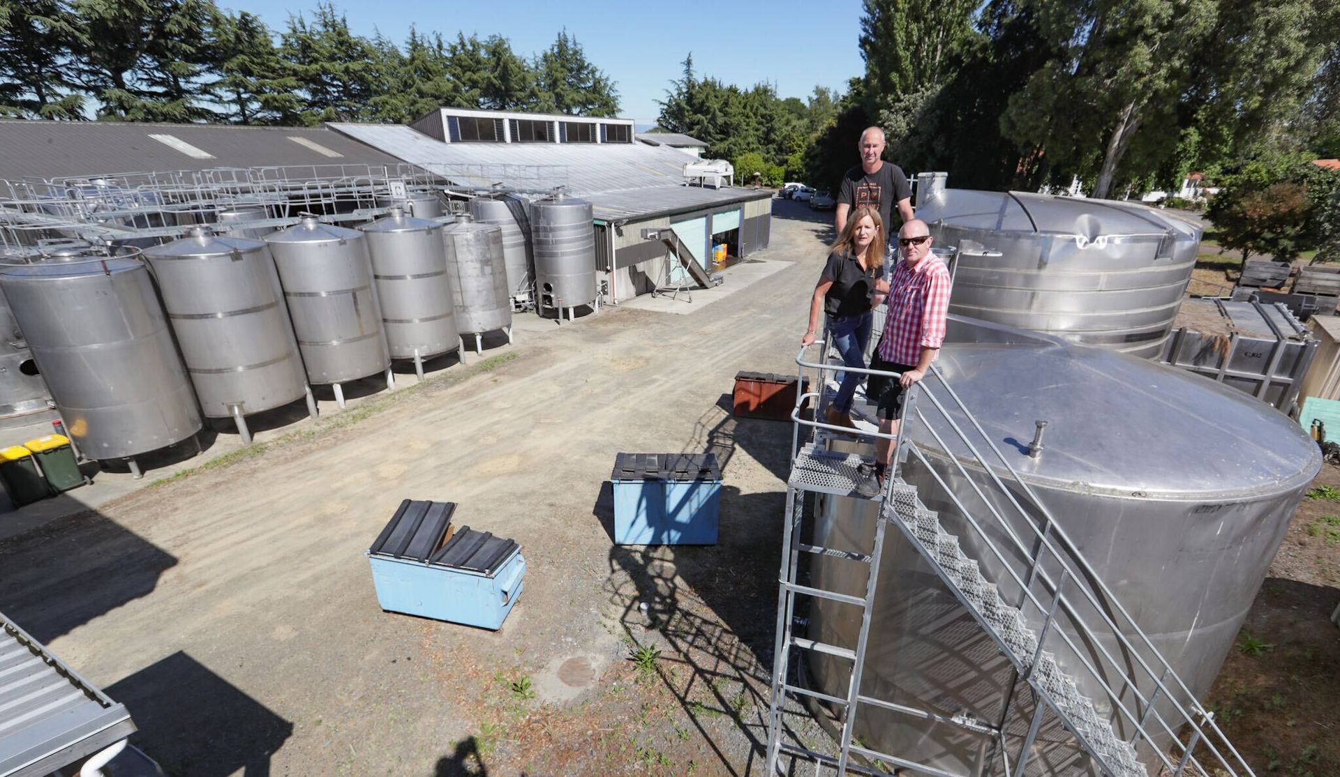 Winemaker Paul Smith (centre) pictured with Margaret Kilkolly and Moore Haszard said the redevelopment is great timing with 2019 and 2020 vintages being released. Photo / Warren Buckland