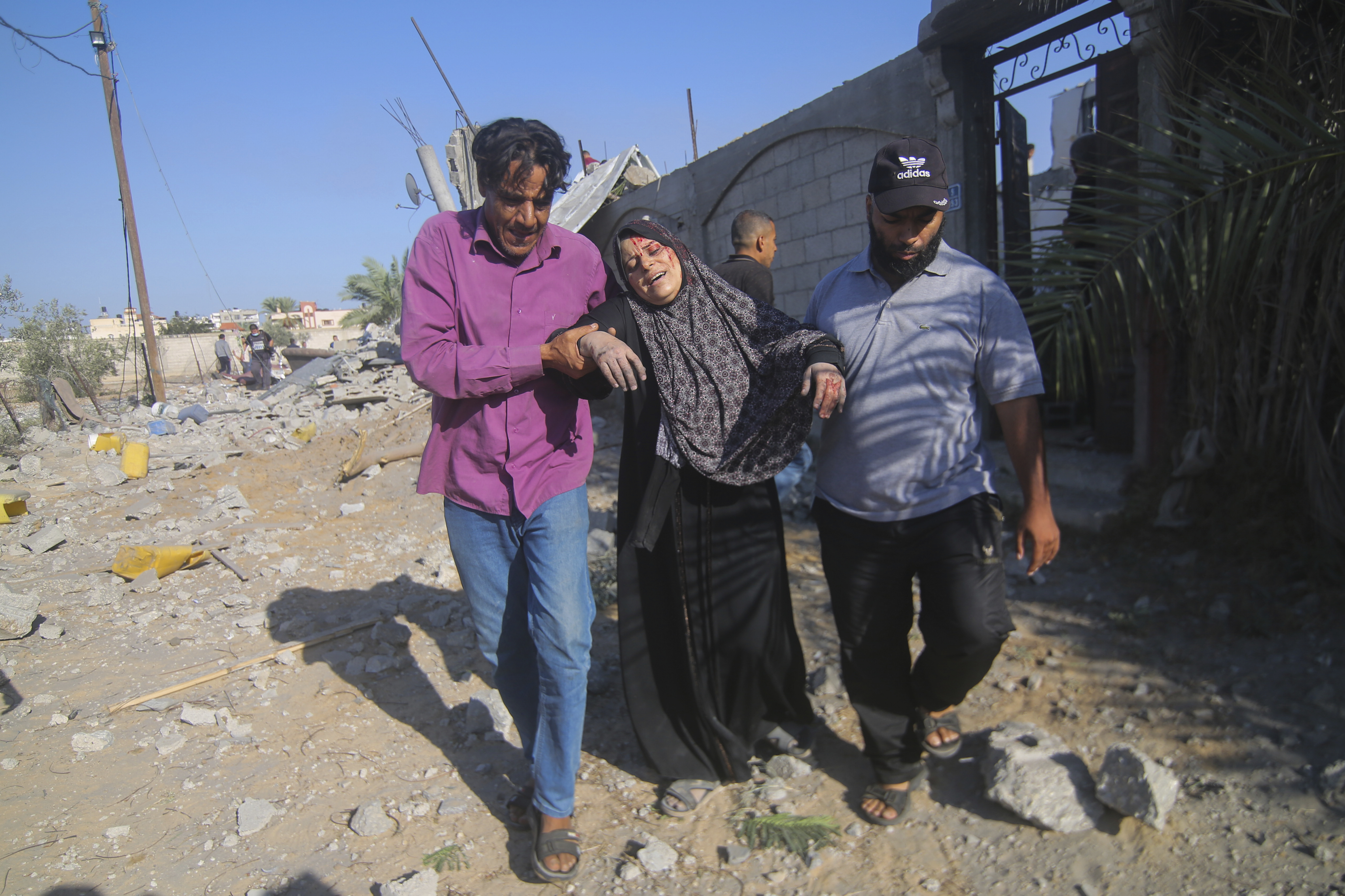 Palestinians evacuate a wounded woman after an Israeli airstrike in Rafah, Gaza Strip. Photo / AP