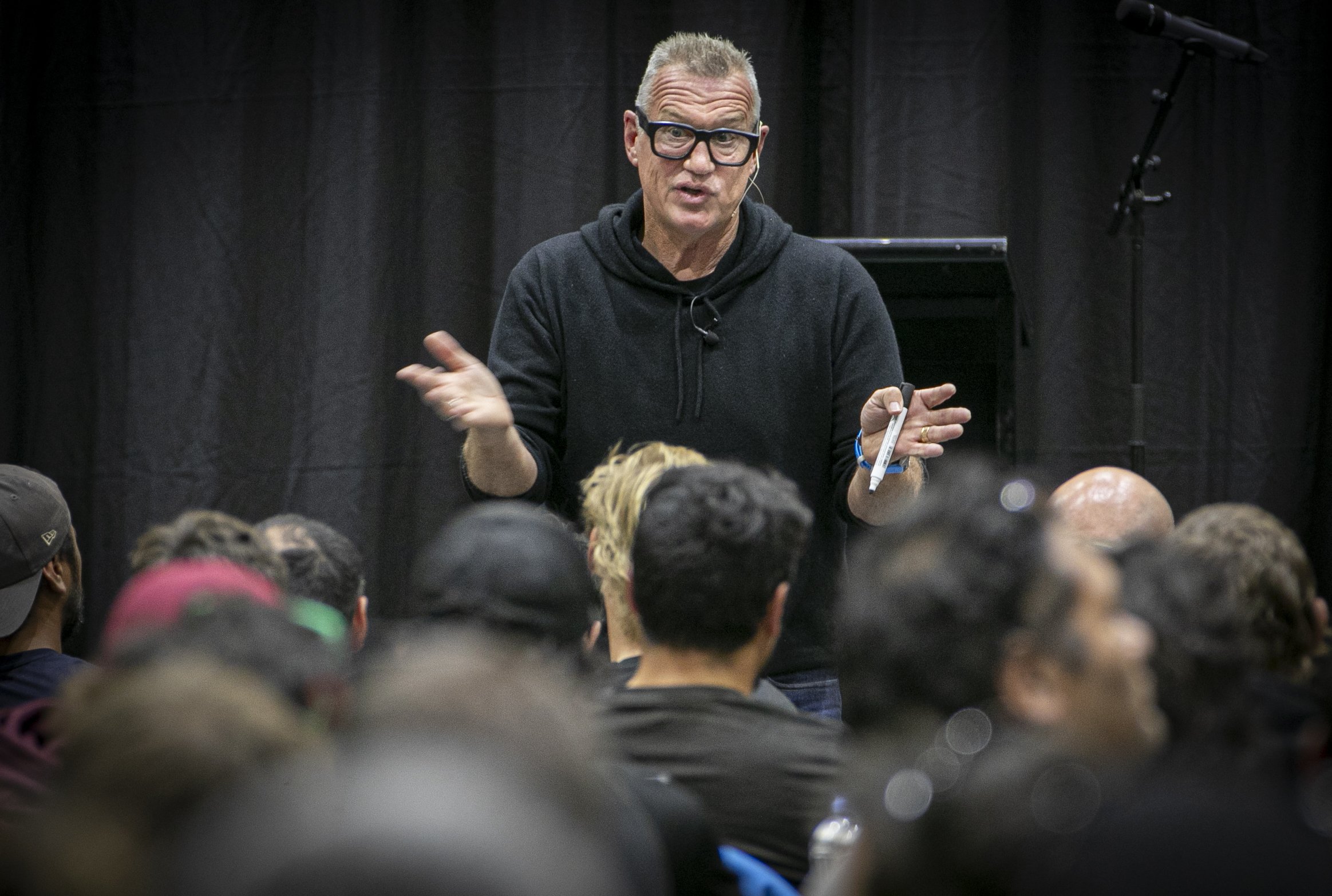 Sir John Kirwan, mental health advocate, talks to TW Group tradespeople at Centennial Hall, Napier. Photo / Warren Buckland
