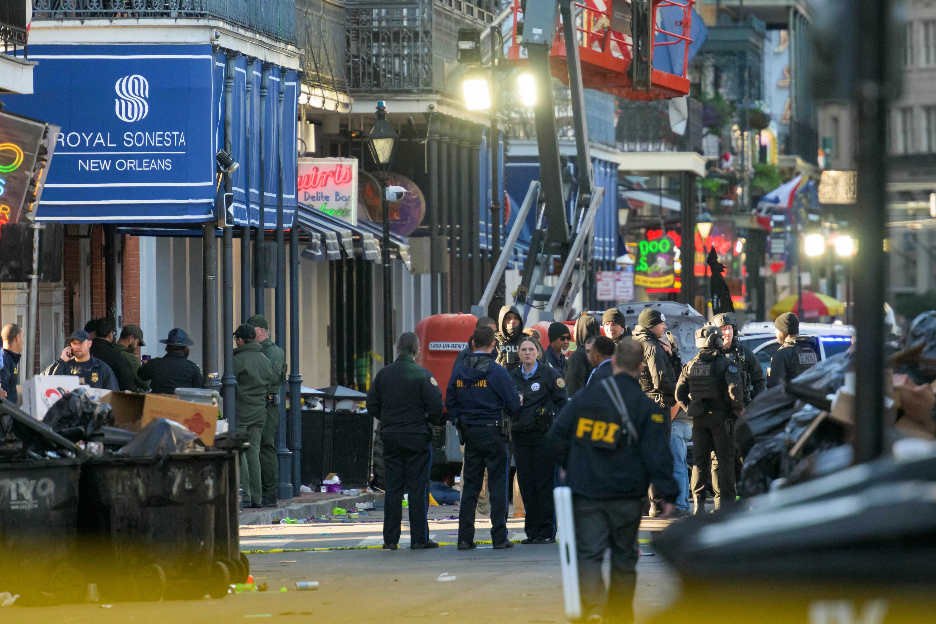 FBI investigators arrive at the scene where a white Ford F-150 pick-up truck allegedly drove into a crowd of New Year's revellers in the French Quarter of New Orleans. Photo / AFP