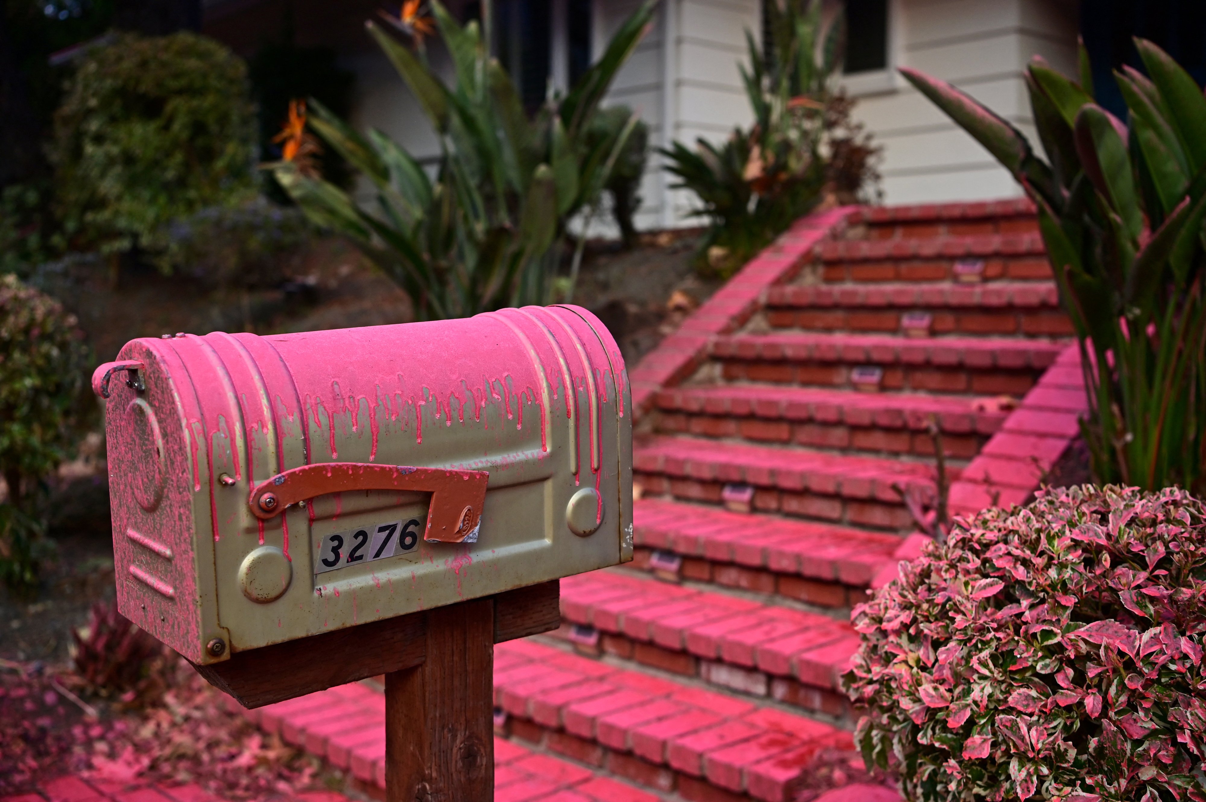 Red flame retardant is seen on the mailbox of a home in the Mandeville Canyon neighbourhood of Los Angeles. Photo / AFP