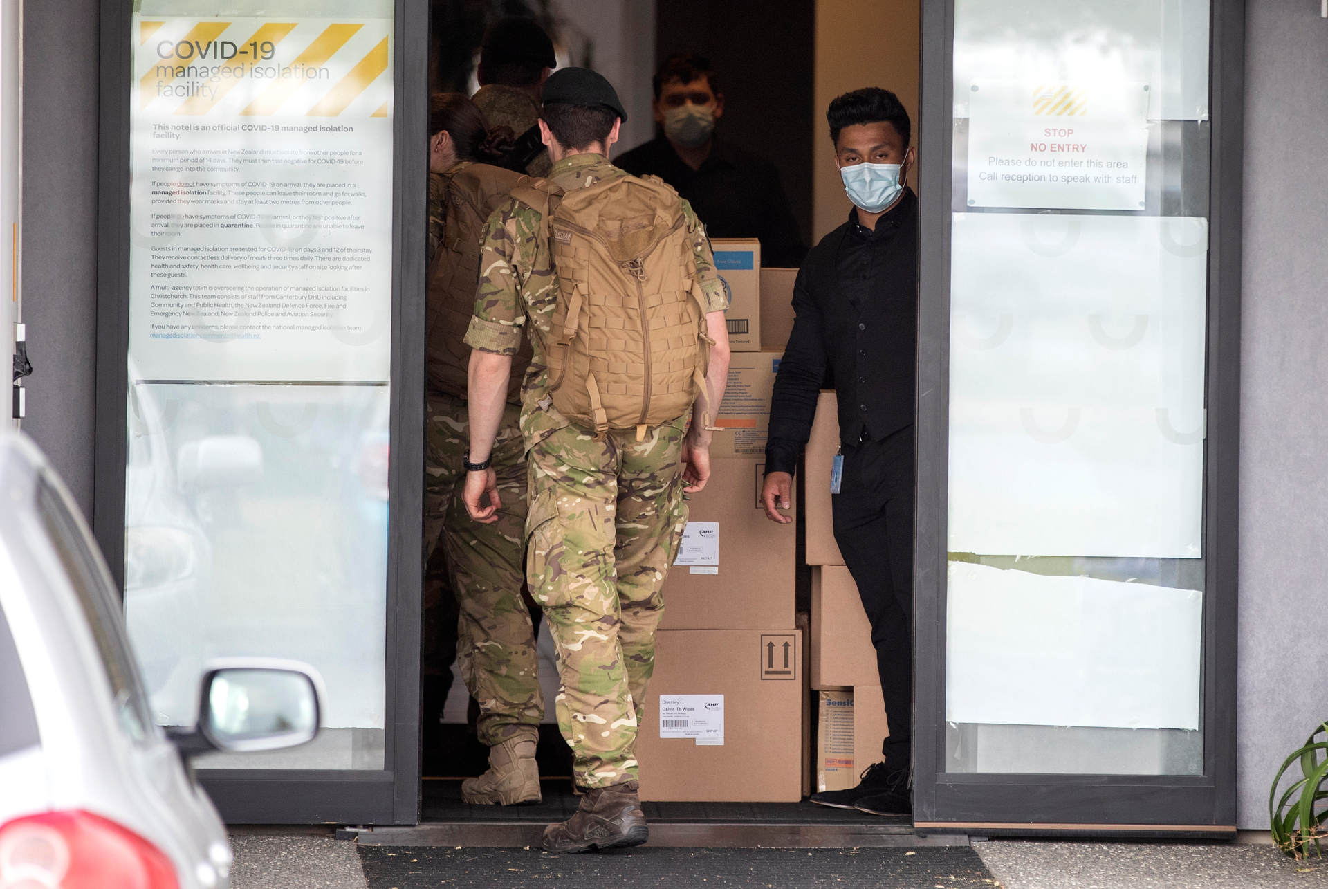 Military personnel enter the Sudima Hotel quarantine facility in Christchurch. Photo / AP
