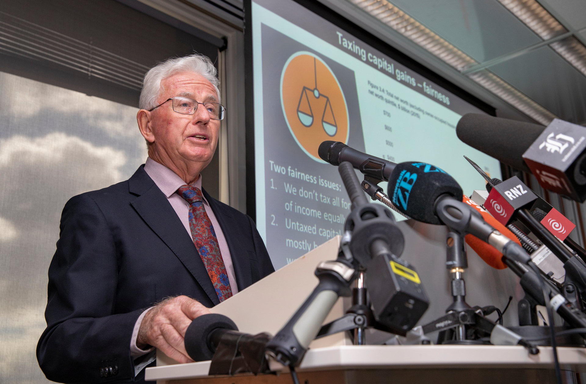 Sir Michael Cullen discussing the findings of the tax working group. Photo / Mark Mitchell