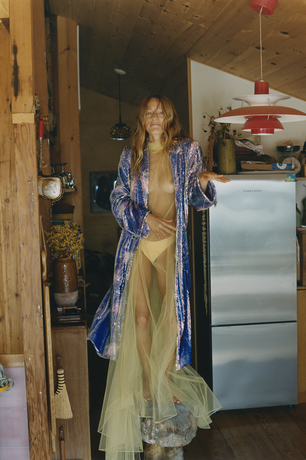 As one of New Zealand’s most successful models, Zippy travels frequently, but the chance to combine work and play continues at home in Montauk. She wears a dreamy lemon tulle dress, shimmering coat by Claudia Li and her own bikini bottoms. Photo / Terence Connors