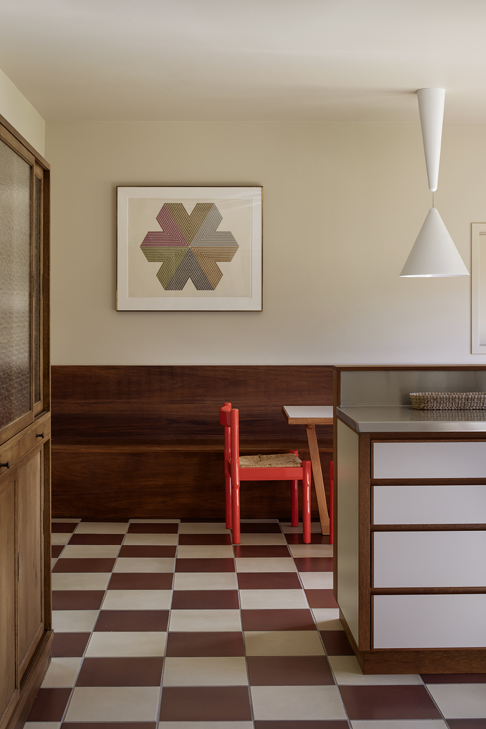 Northcote home featuring a ‘Star of Persia’ print by Frank Stella and ‘Carimate’ chair by Vico Magistretti. Photo / David Straight