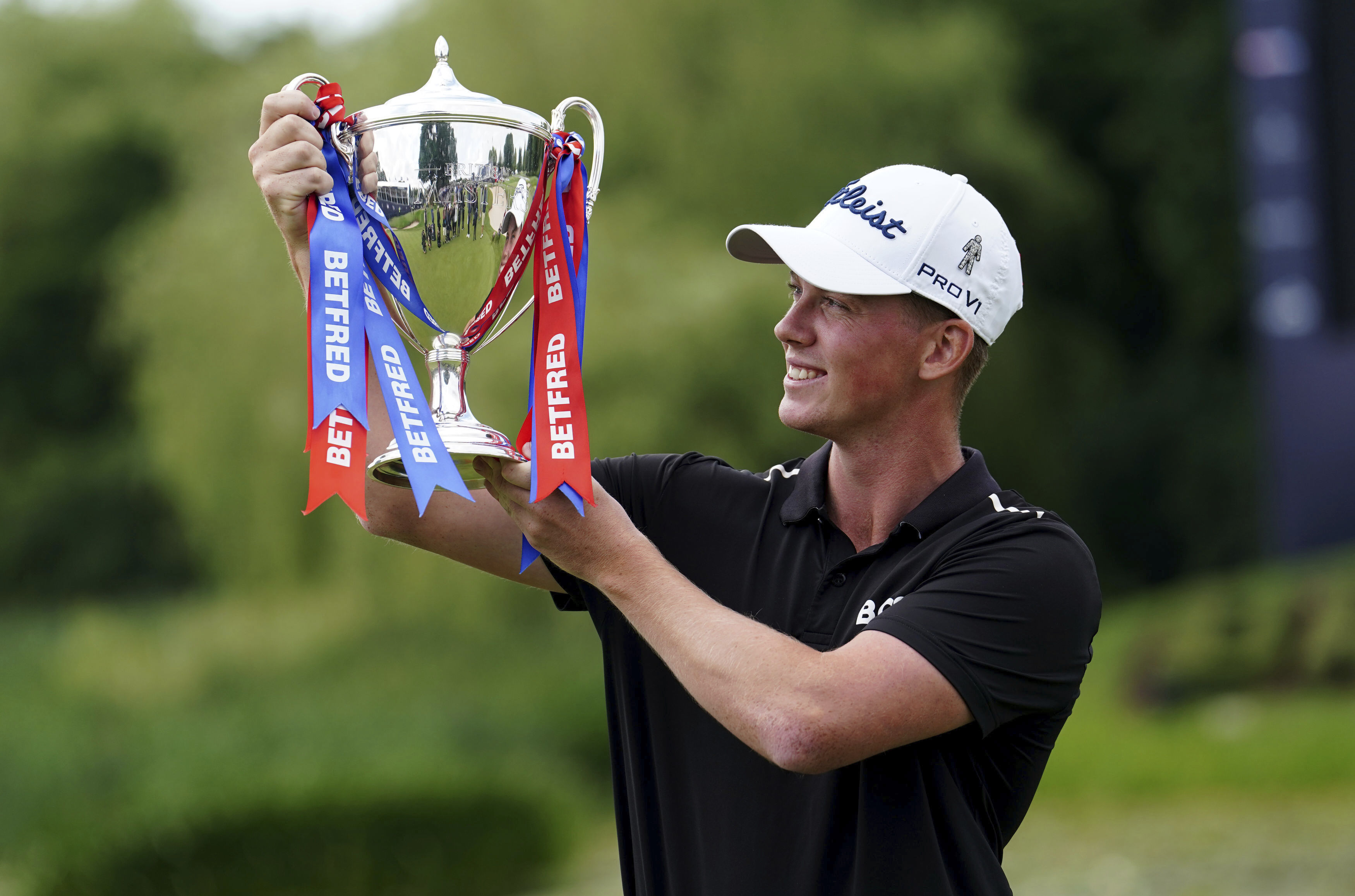 Daniel Hillier of New Zealand poses with the British Masters trophy. Photo / AP