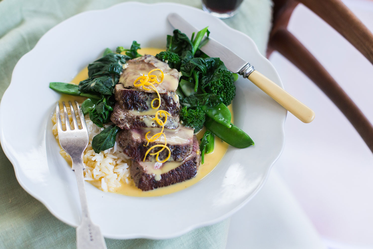 Panfried lamb shortloin with greens and greek lemon sauce-image