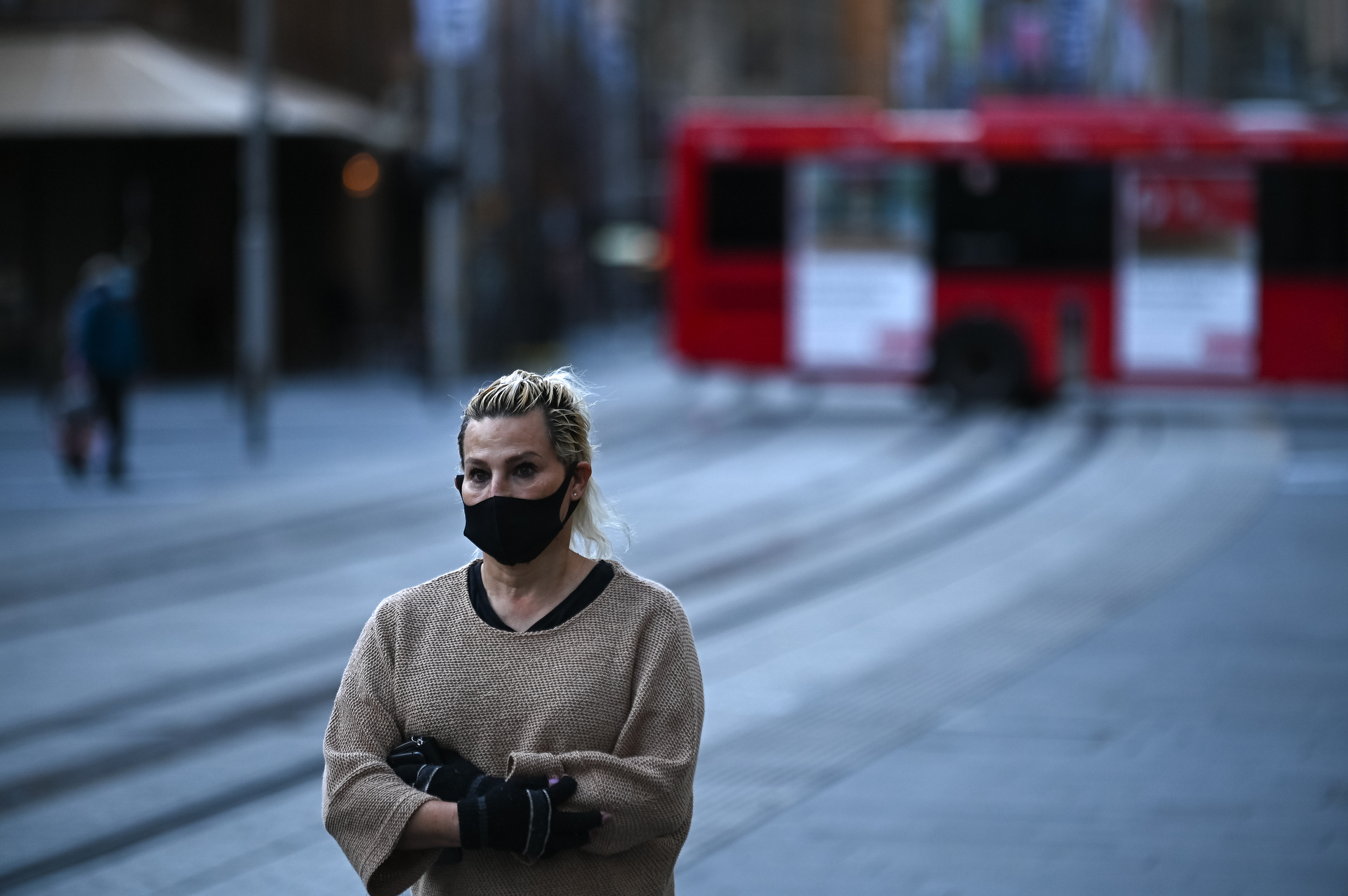 A woman walks through the empty Sydney CBD during the first day of lockdown in the city. Photo / Getty Images