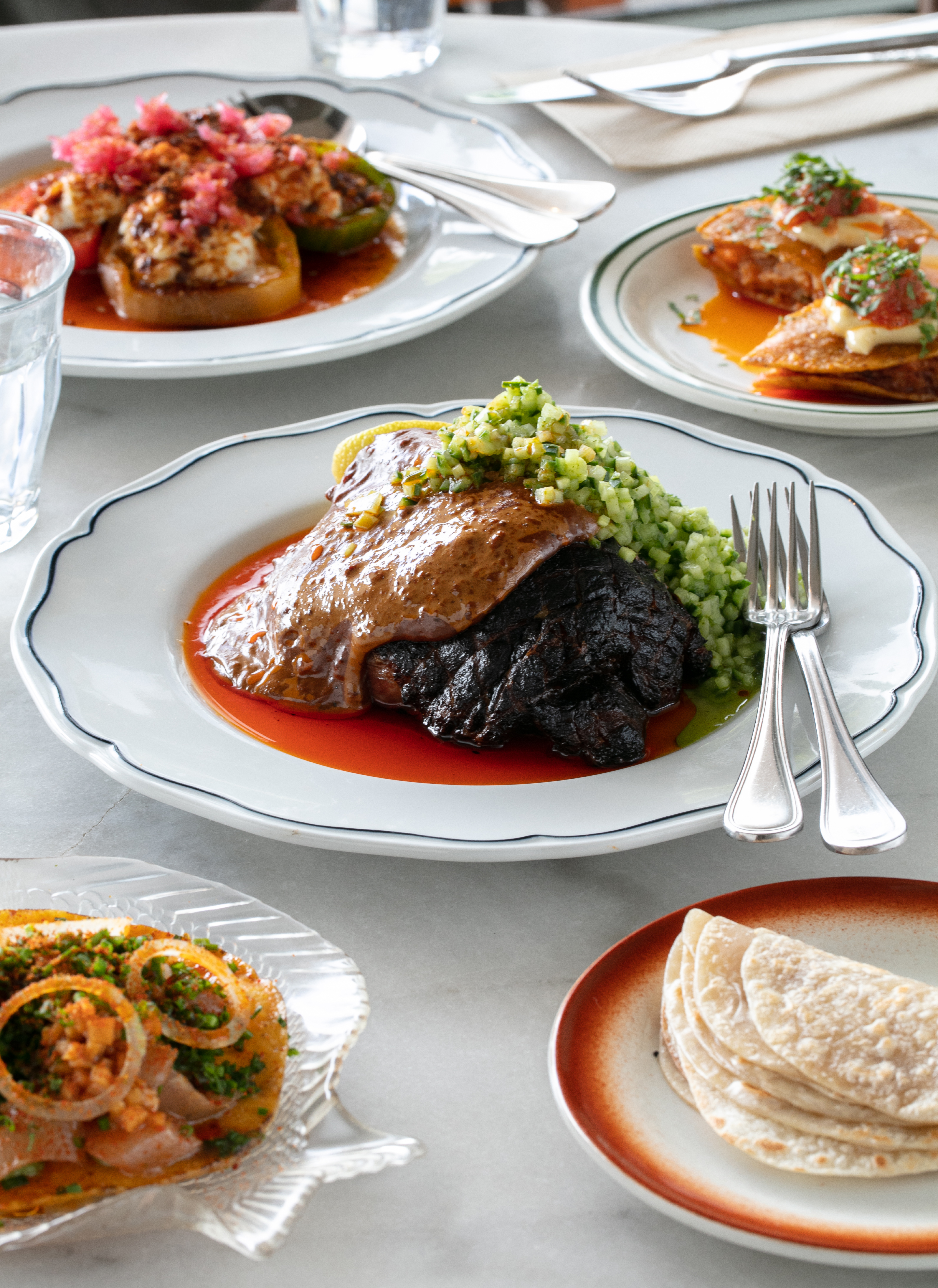 The lamb with tortillas, the cabbage and tomato salad, and the prawn and fish tostadas at Ragtag. Photo / Babiche Martens