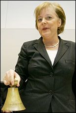 Christian Democrat (CDU) leader and German Chancellor-designate Angela Merkel rings a bell before a meeting of the CDU parliamentary group in Berlin. Picture / Reuters