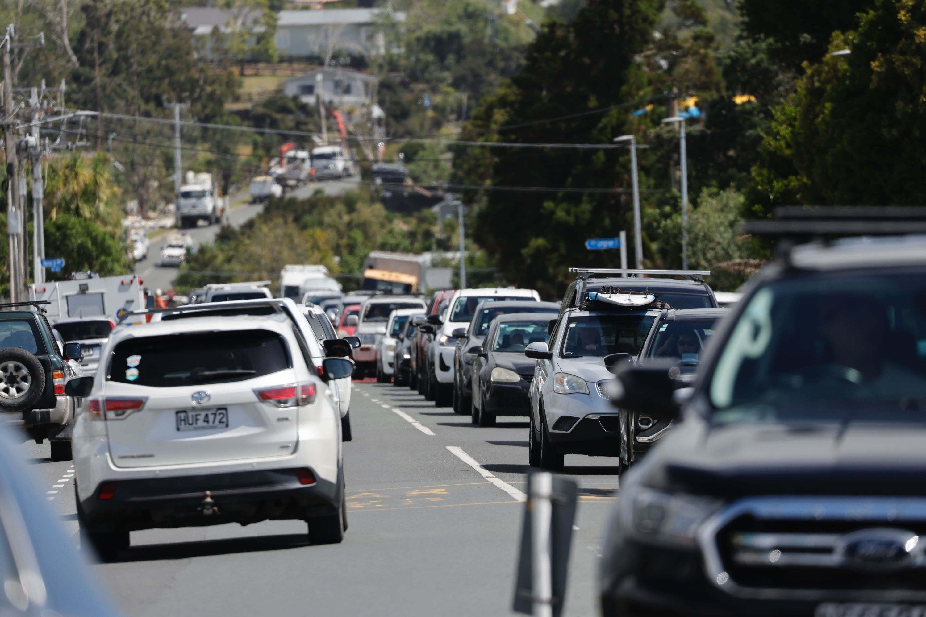 Traffic on Molesworth Drive in Mangawhai this morning. The settlement north of Auckland was hit by a damaging tornado in the early hours of yesterday morning. Photo / Michael Craig