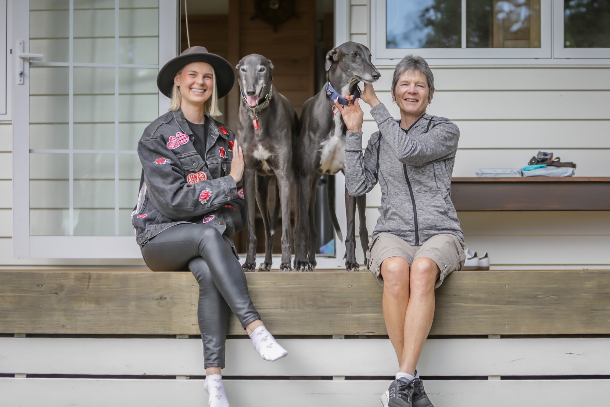  Greyhounds as Pets volunteers Lauren Kramer with greyhound Marcel and Sandy Henderson with greyhound Merc. Photo / Kelly O'Hara